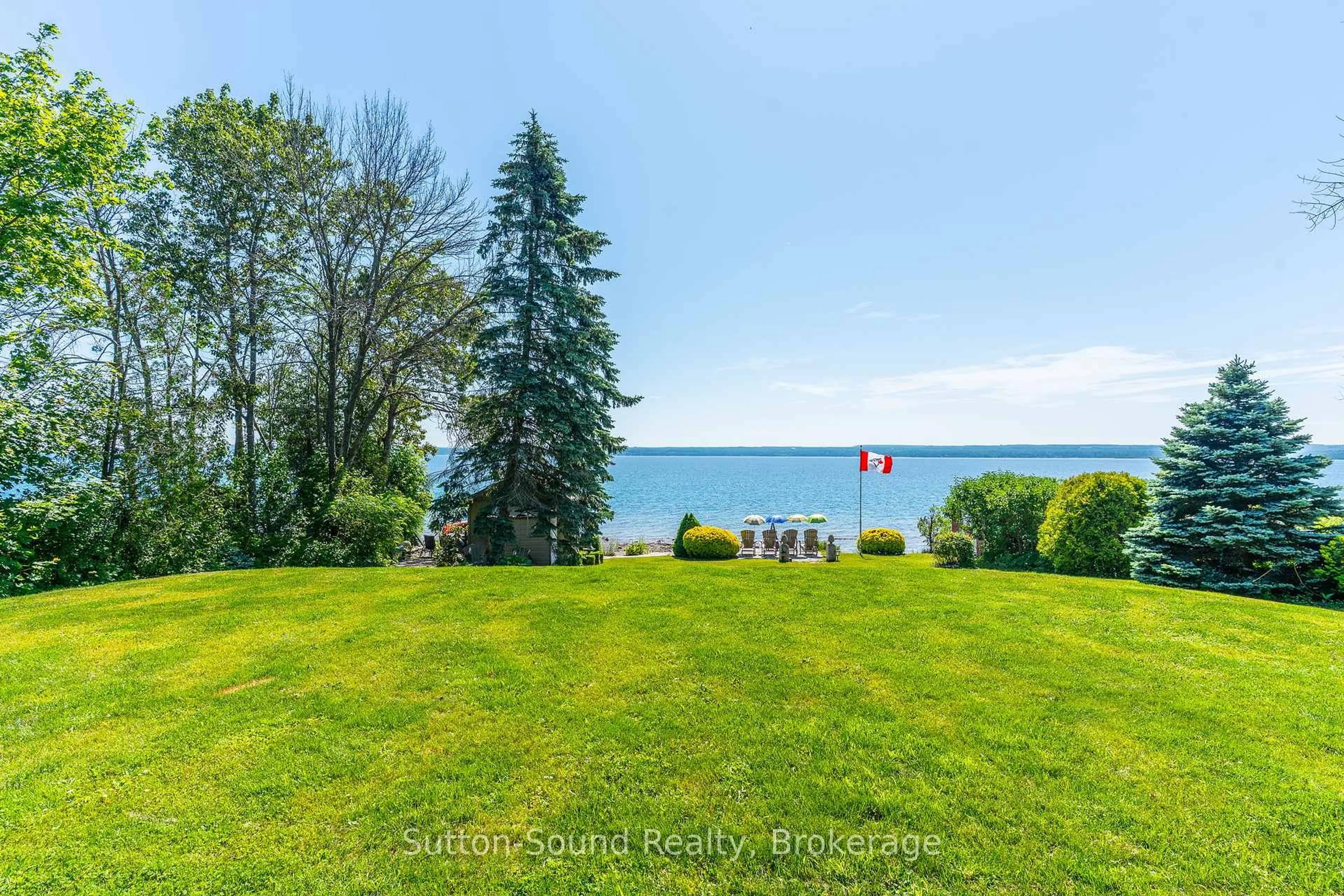A pic from outside/outdoor area/front of a property/back of a property/a pic from drone, water/lake/river/ocean view for 427 Balmy Beach Rd, Georgian Bluffs Ontario N4K 5N4