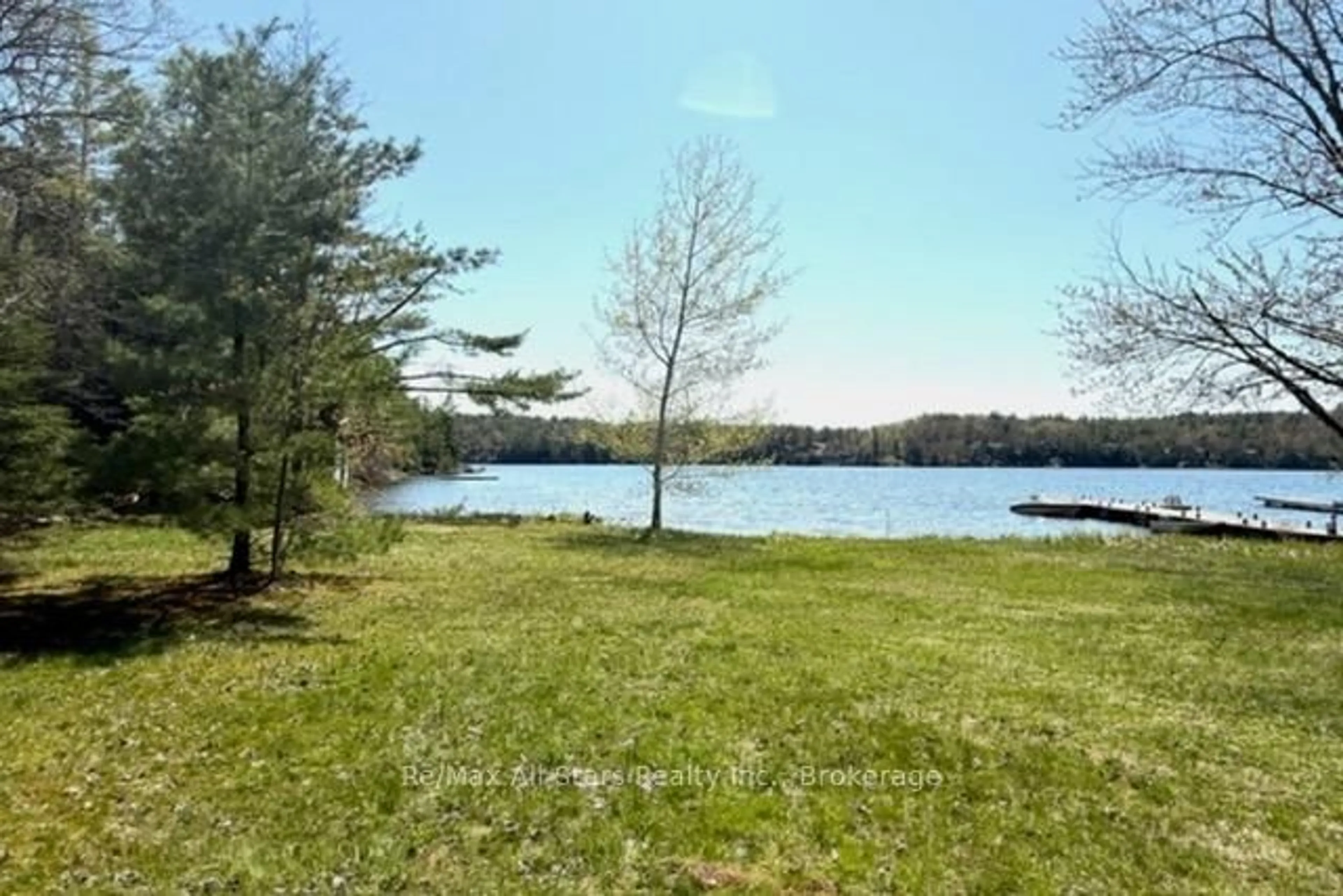 A pic from outside/outdoor area/front of a property/back of a property/a pic from drone, water/lake/river/ocean view for 1019 Osler Lane, Minden Hills Ontario K0M 2K0