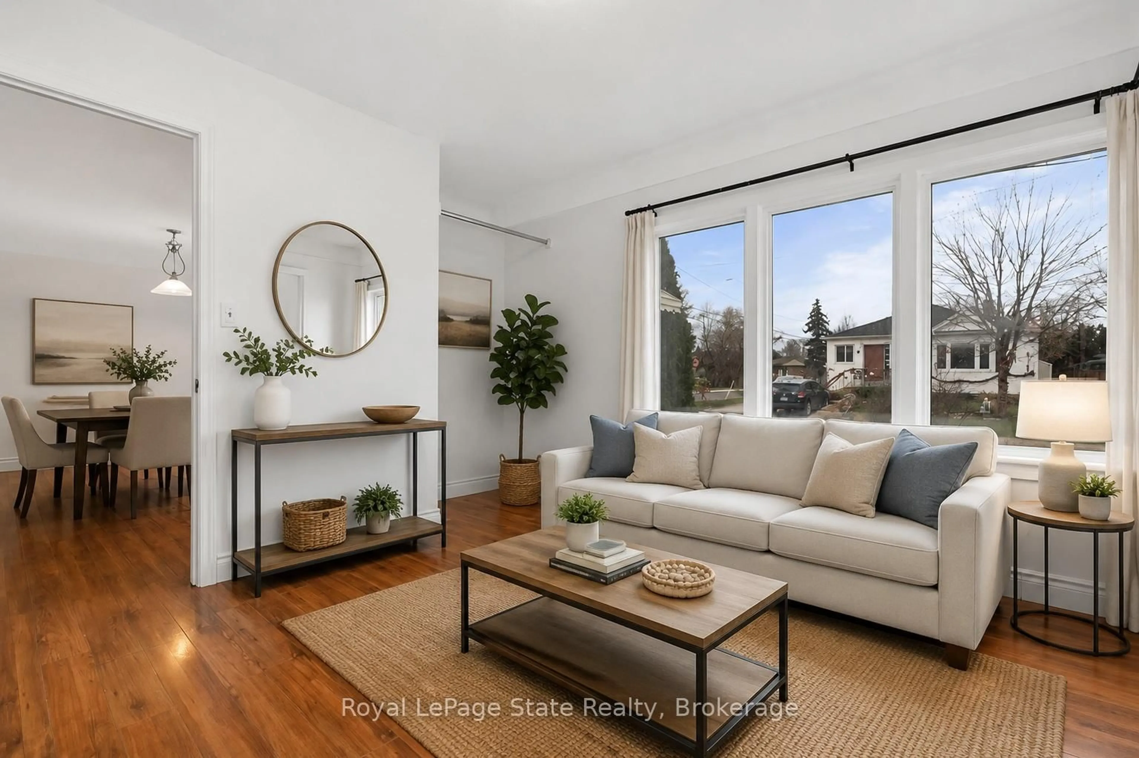 Living room with furniture, wood/laminate floor for 15 West 1st St, Hamilton Ontario L9C 3B5