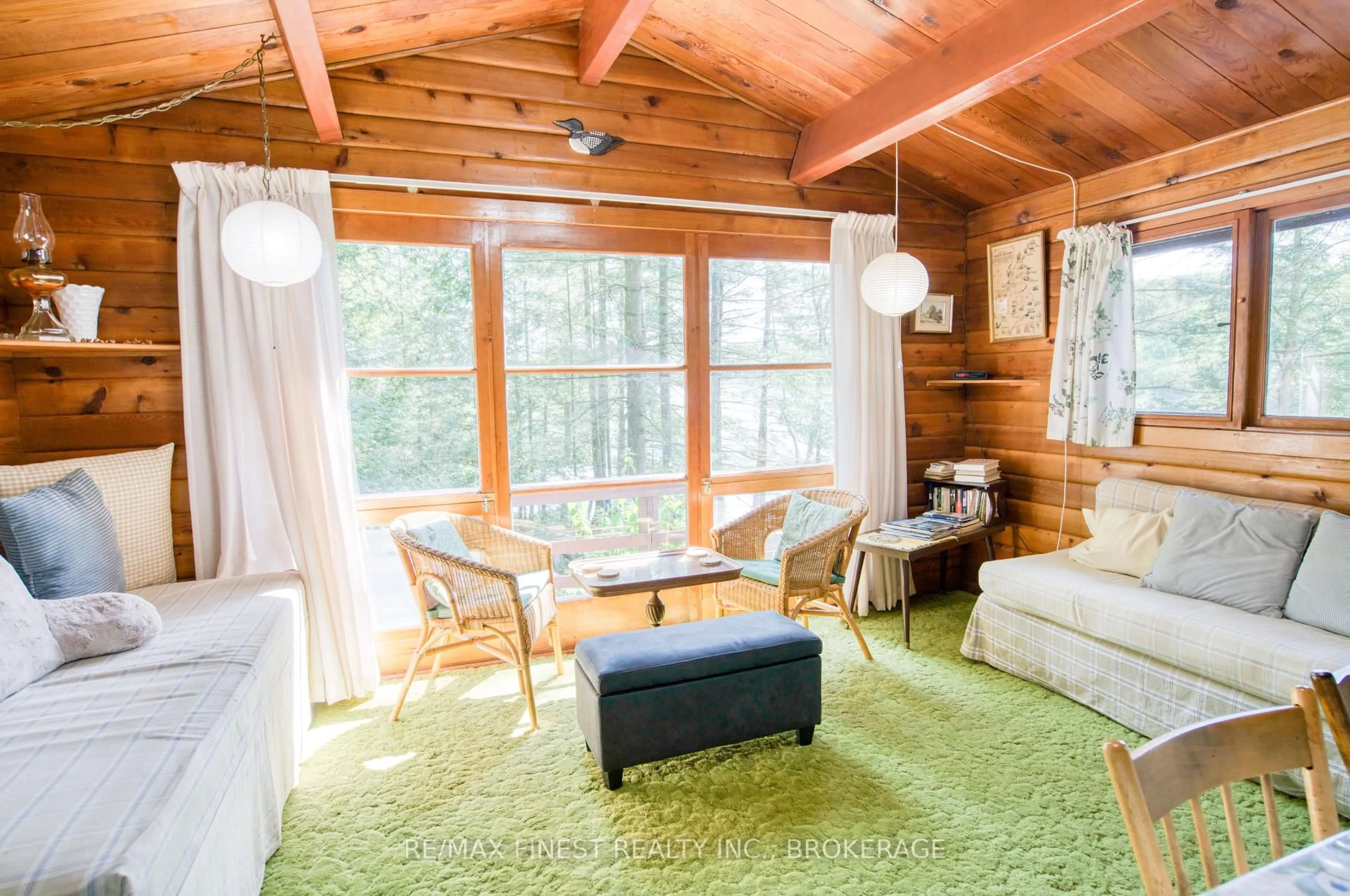 Living room with furniture, wood/laminate floor for 1029 Oak Lane North, Sharbot Lake Ontario K0H 2P0