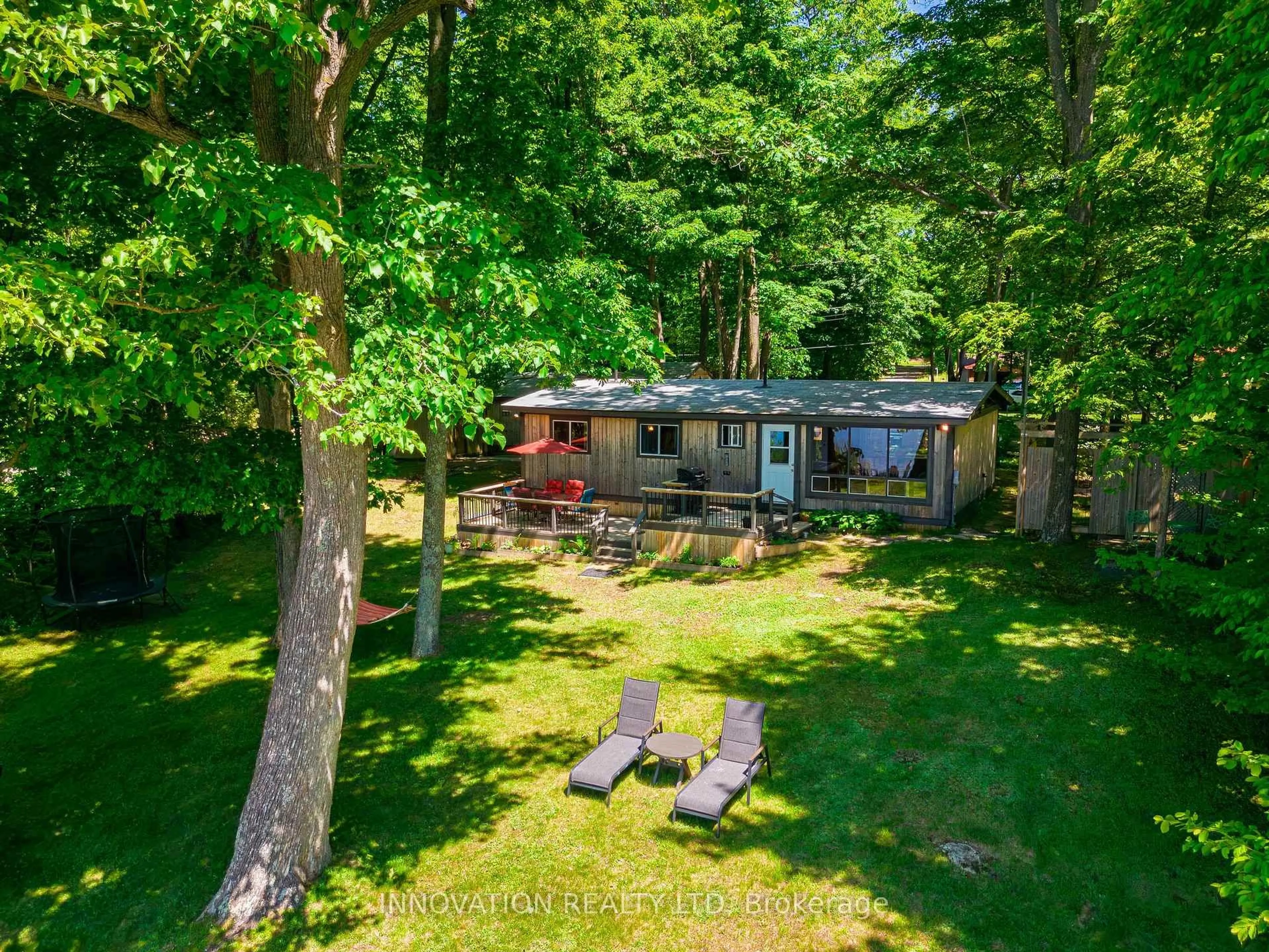 A pic from outside/outdoor area/front of a property/back of a property/a pic from drone, forest/trees view for 102 Norway Point Rd, Carleton Place Ontario K7C 4K8