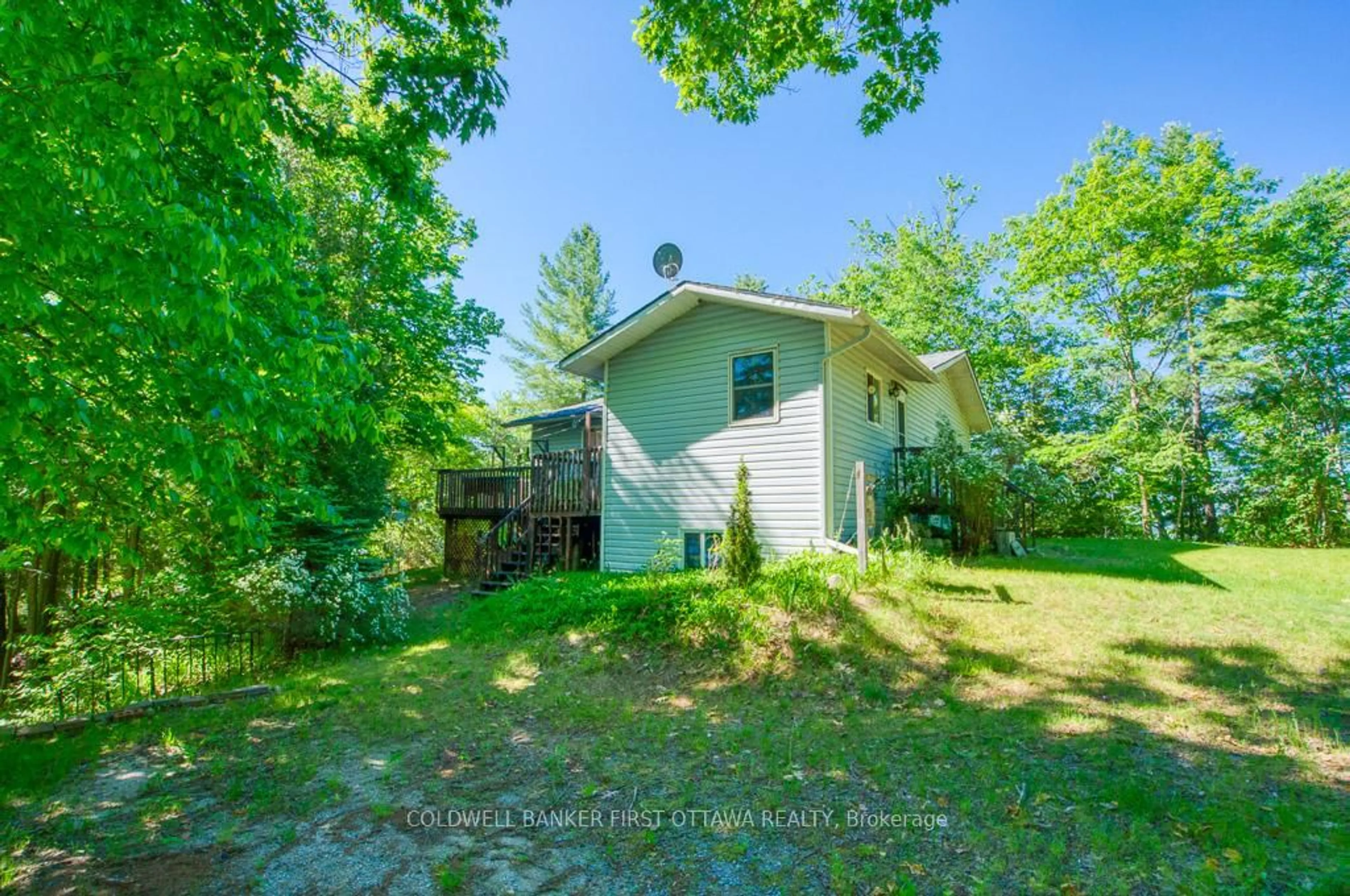 A pic from outside/outdoor area/front of a property/back of a property/a pic from drone, unknown for 1301 D Guigue Rd, Sharbot Lake Ontario K0H 2P0