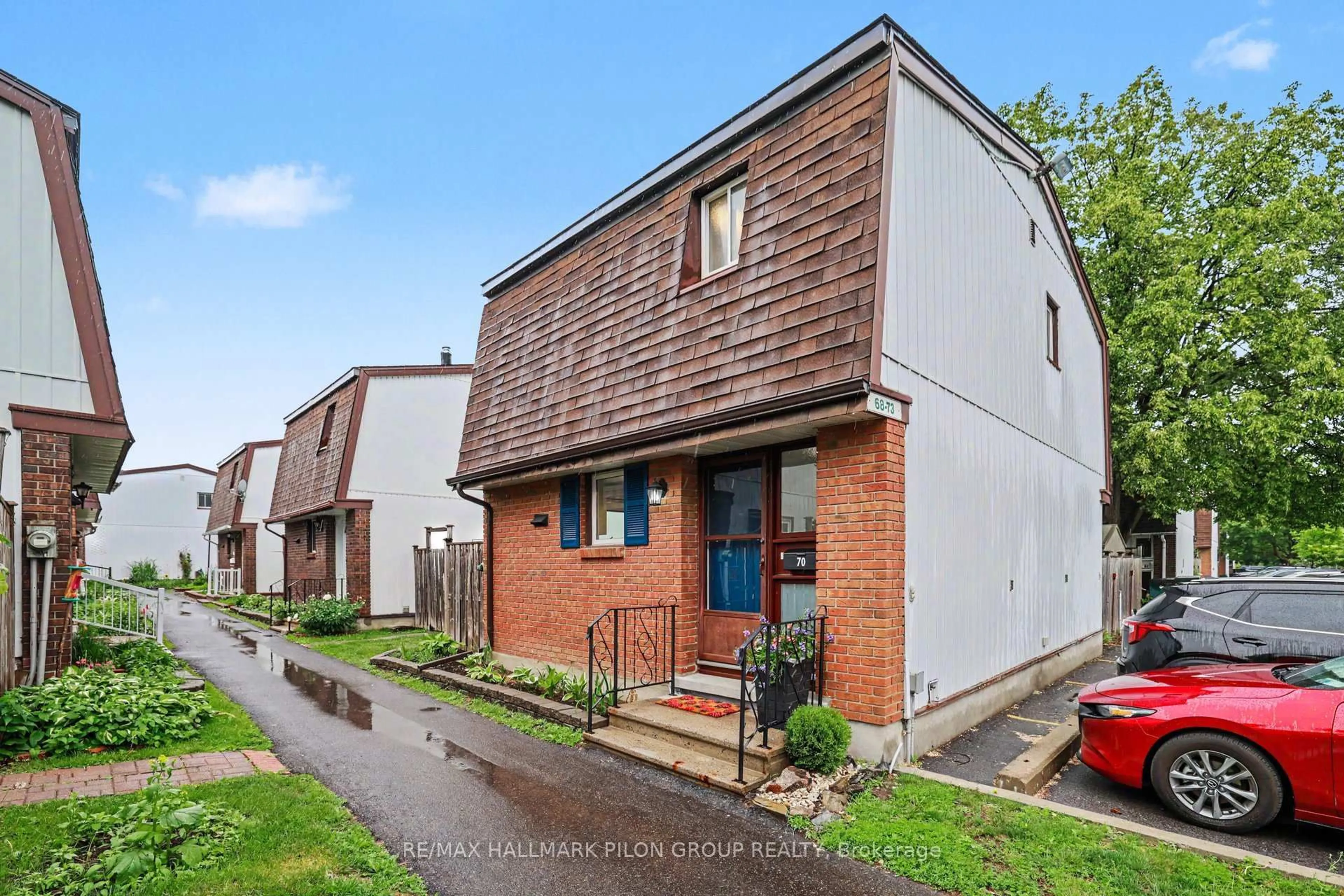 A pic from outside/outdoor area/front of a property/back of a property/a pic from drone, street for 2210 Loyola Ave #70, Ottawa Ontario K1J 8H5