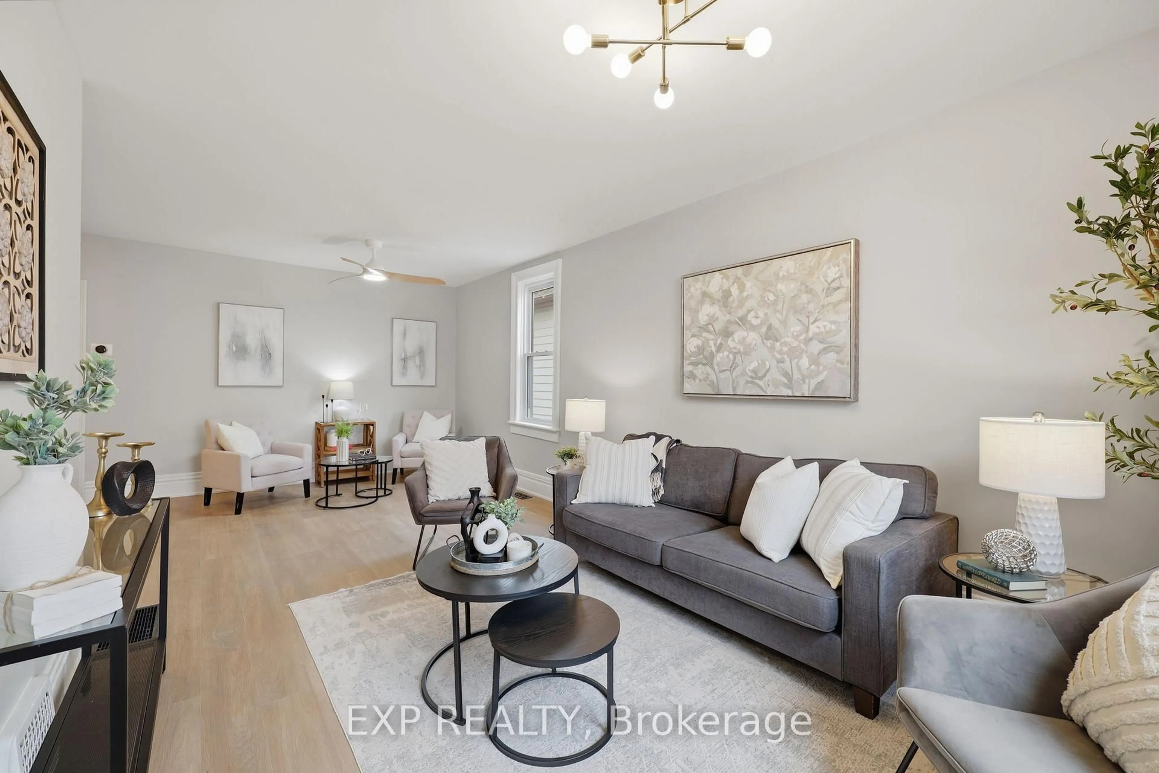 Living room with furniture, wood/laminate floor for 225 Ross St, St. Thomas Ontario N5R 3Y5