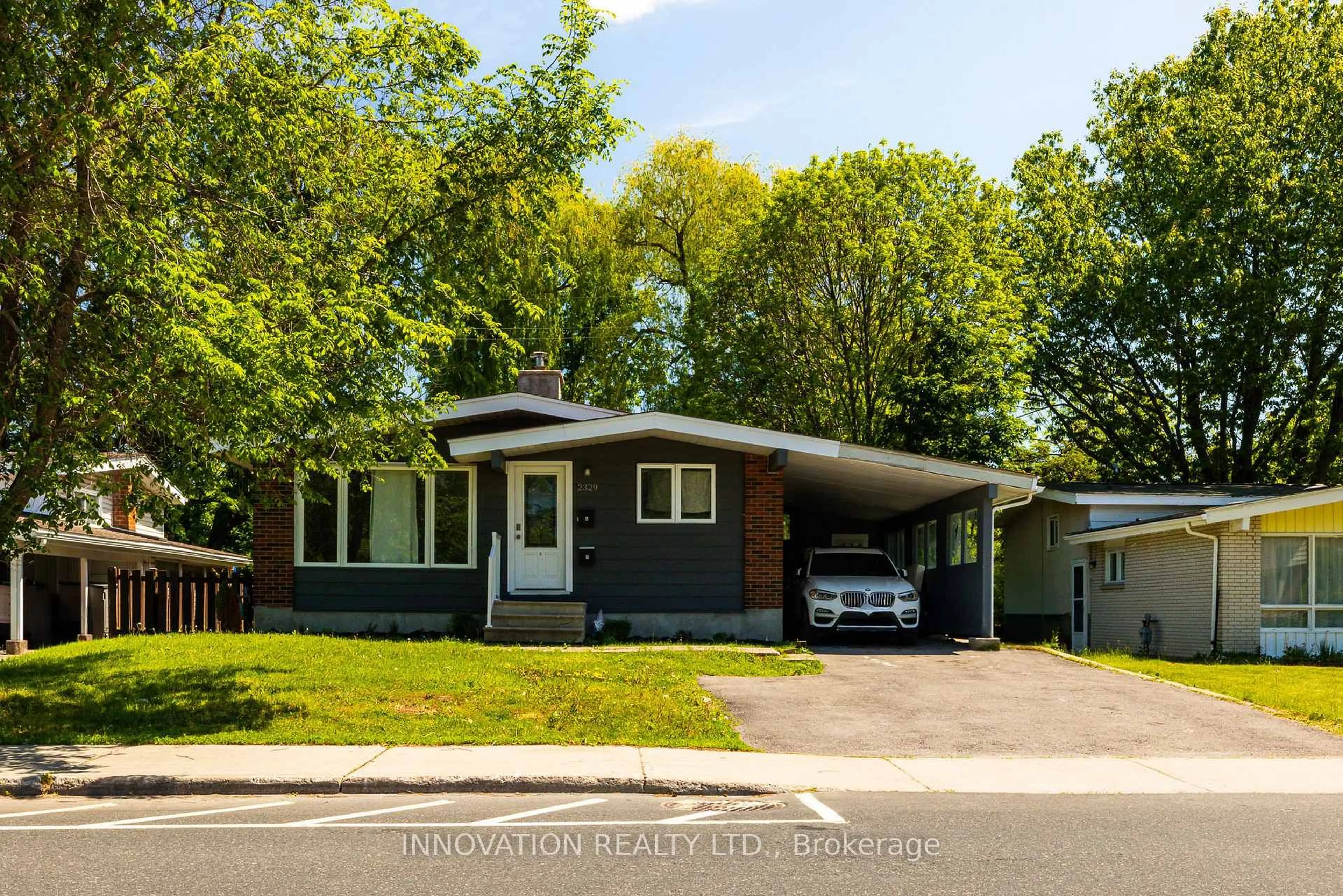 Home with vinyl exterior material, street for 2329 Ryder St, Ottawa Ontario K1H 6X4
