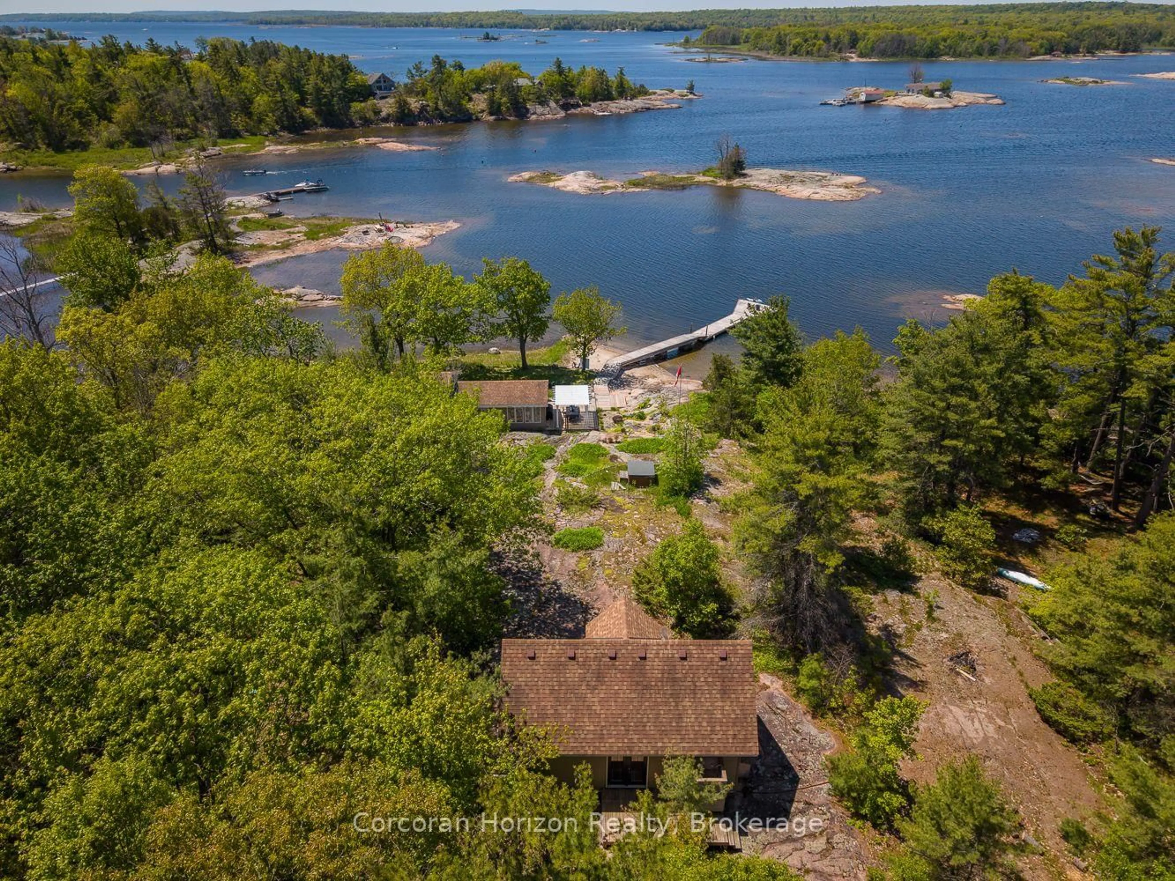 A pic from outside/outdoor area/front of a property/back of a property/a pic from drone, water/lake/river/ocean view for 4476 Island 1040/Little Beausoleil Island, Georgian Bay Ontario P0E 1E0