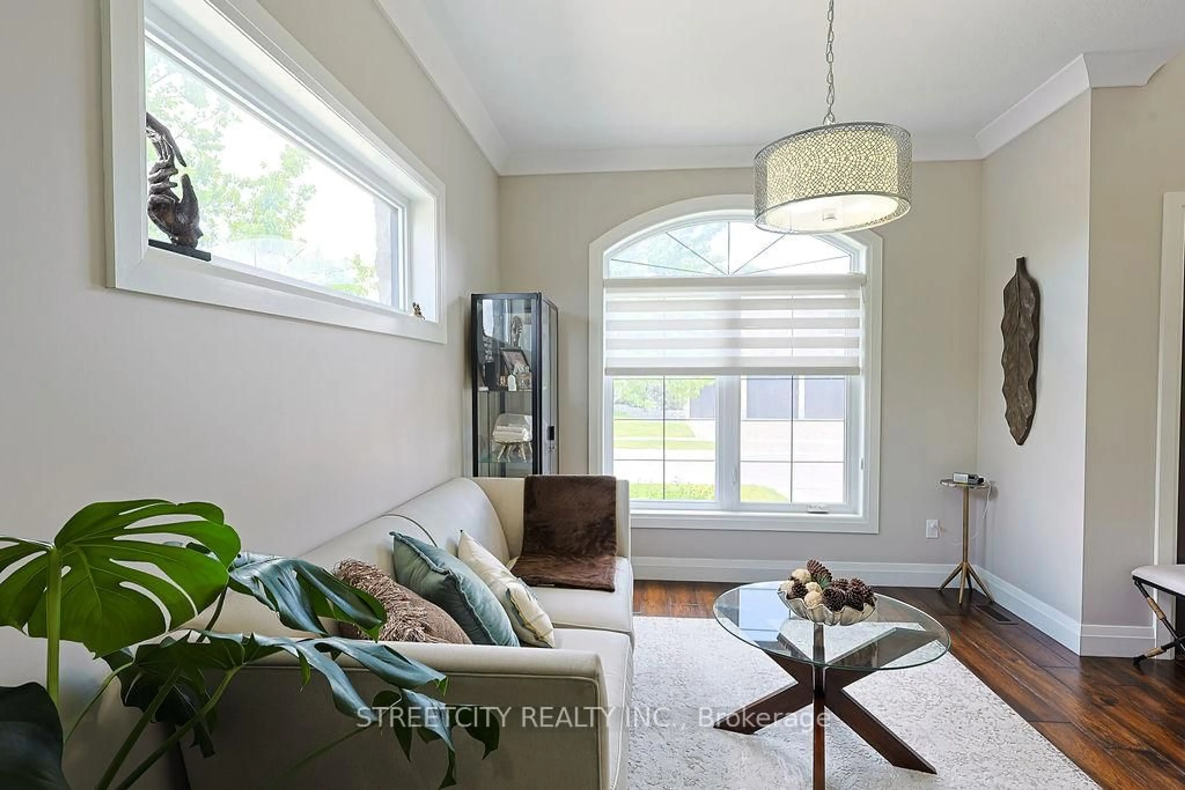 Living room with furniture, wood/laminate floor for 3181 Gristmill Lane, London South Ontario N6P 0C1