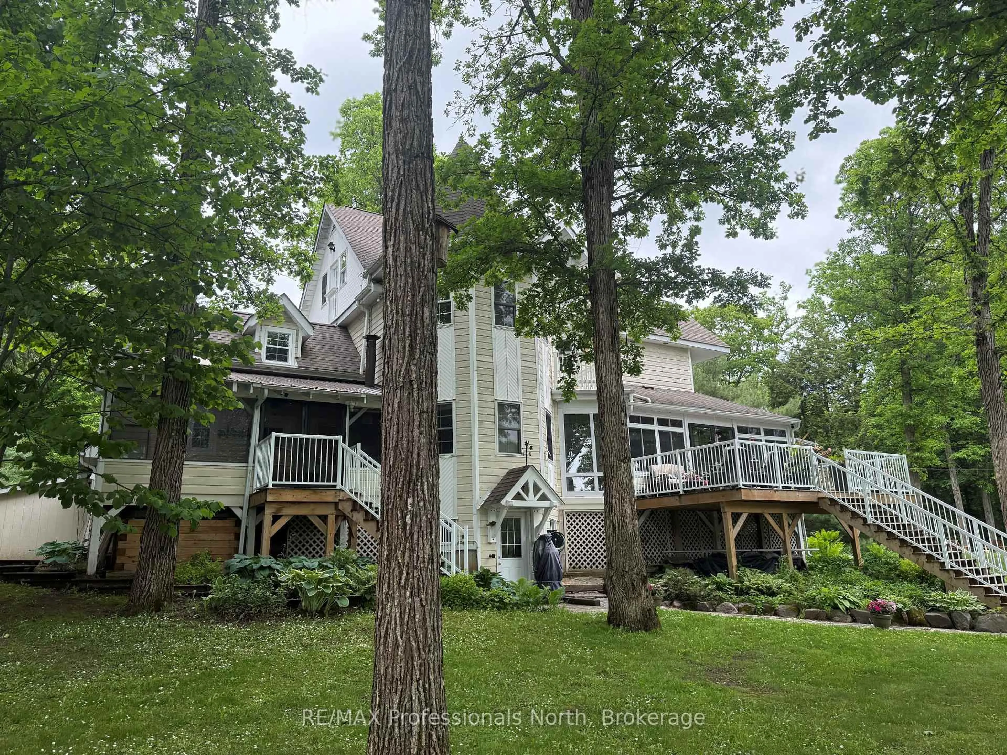 A pic from outside/outdoor area/front of a property/back of a property/a pic from drone, forest/trees view for 22 Knowles Cres, Seguin Ontario P0C 1J0