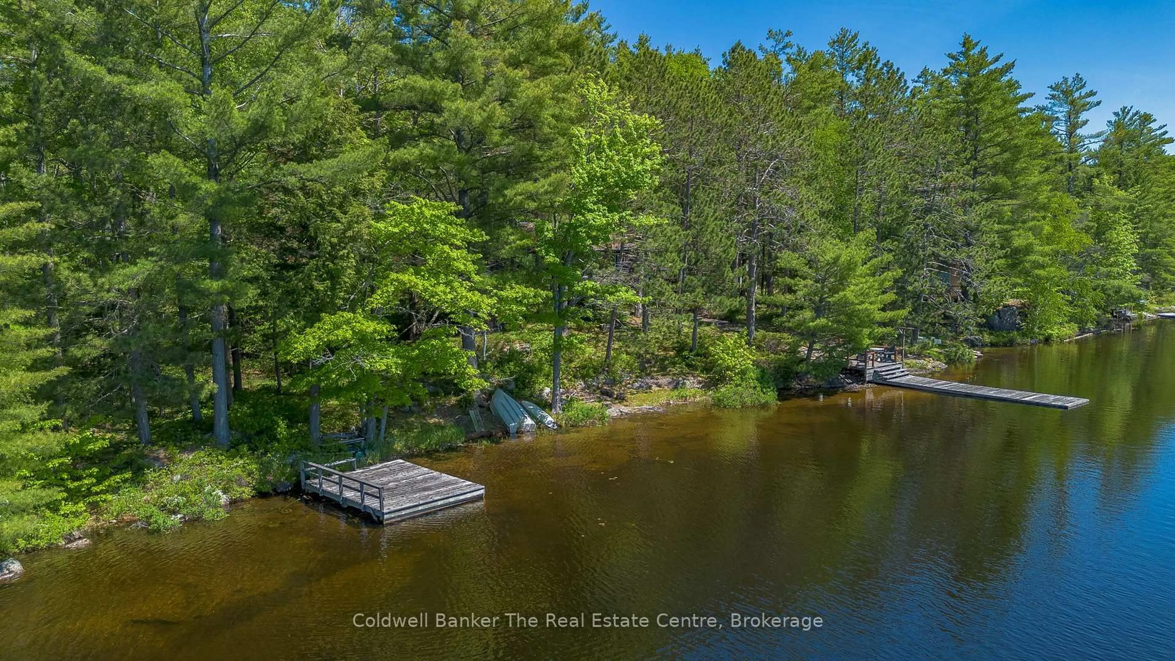 A pic from outside/outdoor area/front of a property/back of a property/a pic from drone, water/lake/river/ocean view for 1077 Misty Lane, Gravenhurst Ontario P0E 1G0