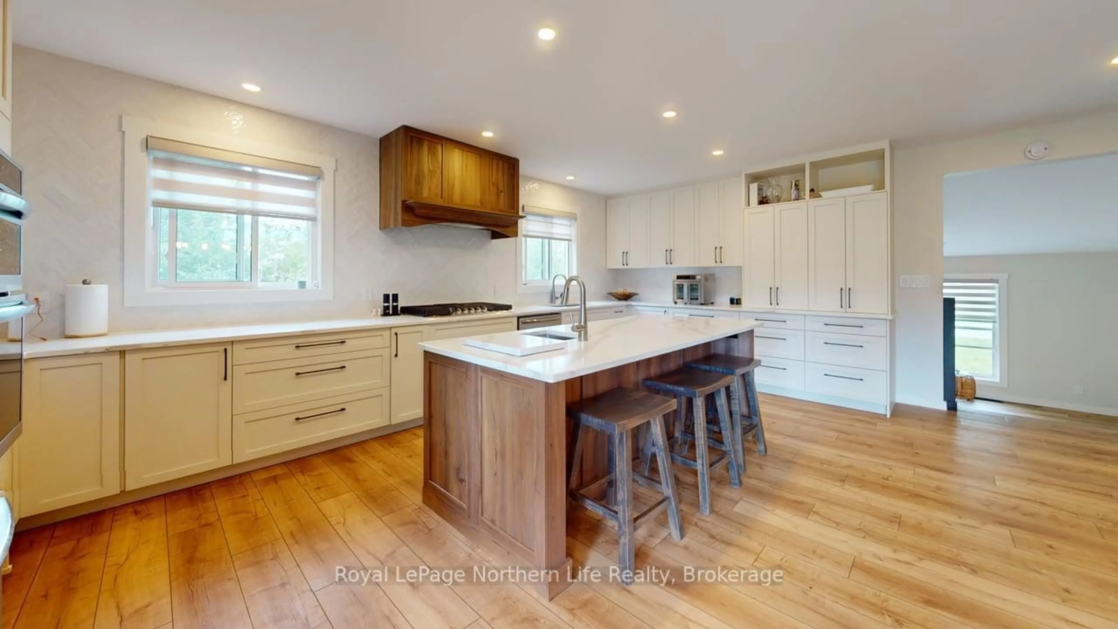 Open concept kitchen, wood/laminate floor for 226 Springer St, West Nipissing Ontario P2B 3B8