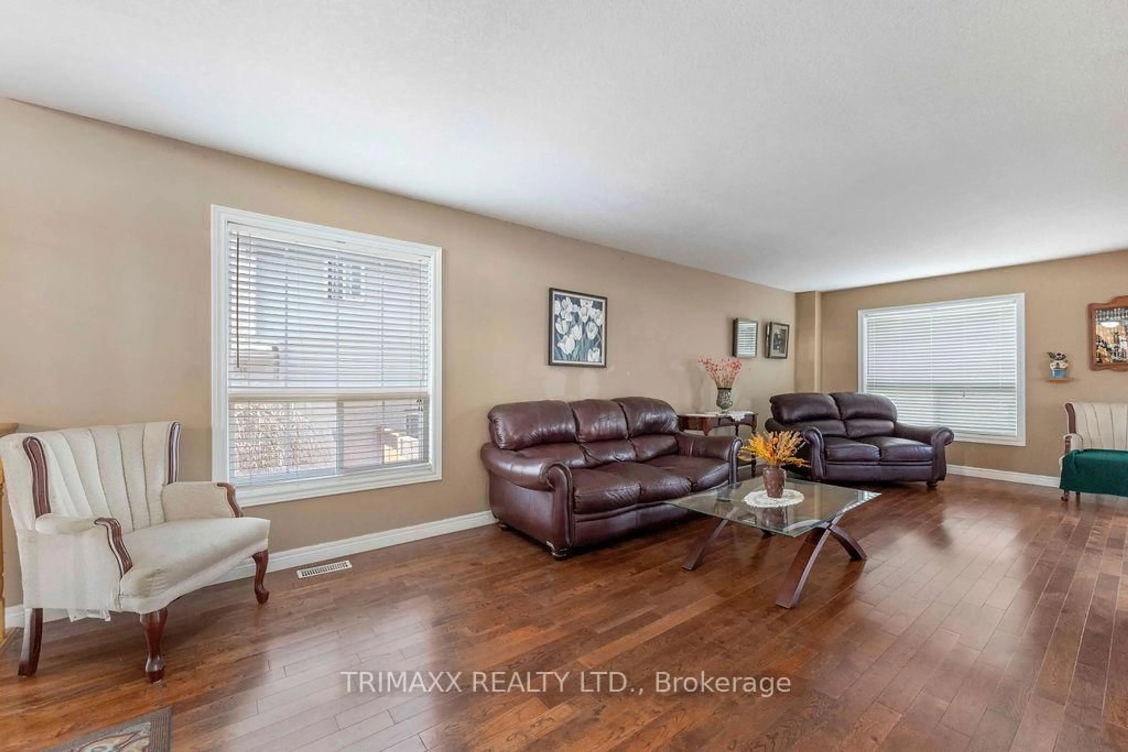 Living room with furniture, wood/laminate floor for 141 STARWOOD DR, Guelph Ontario N1E 7G7