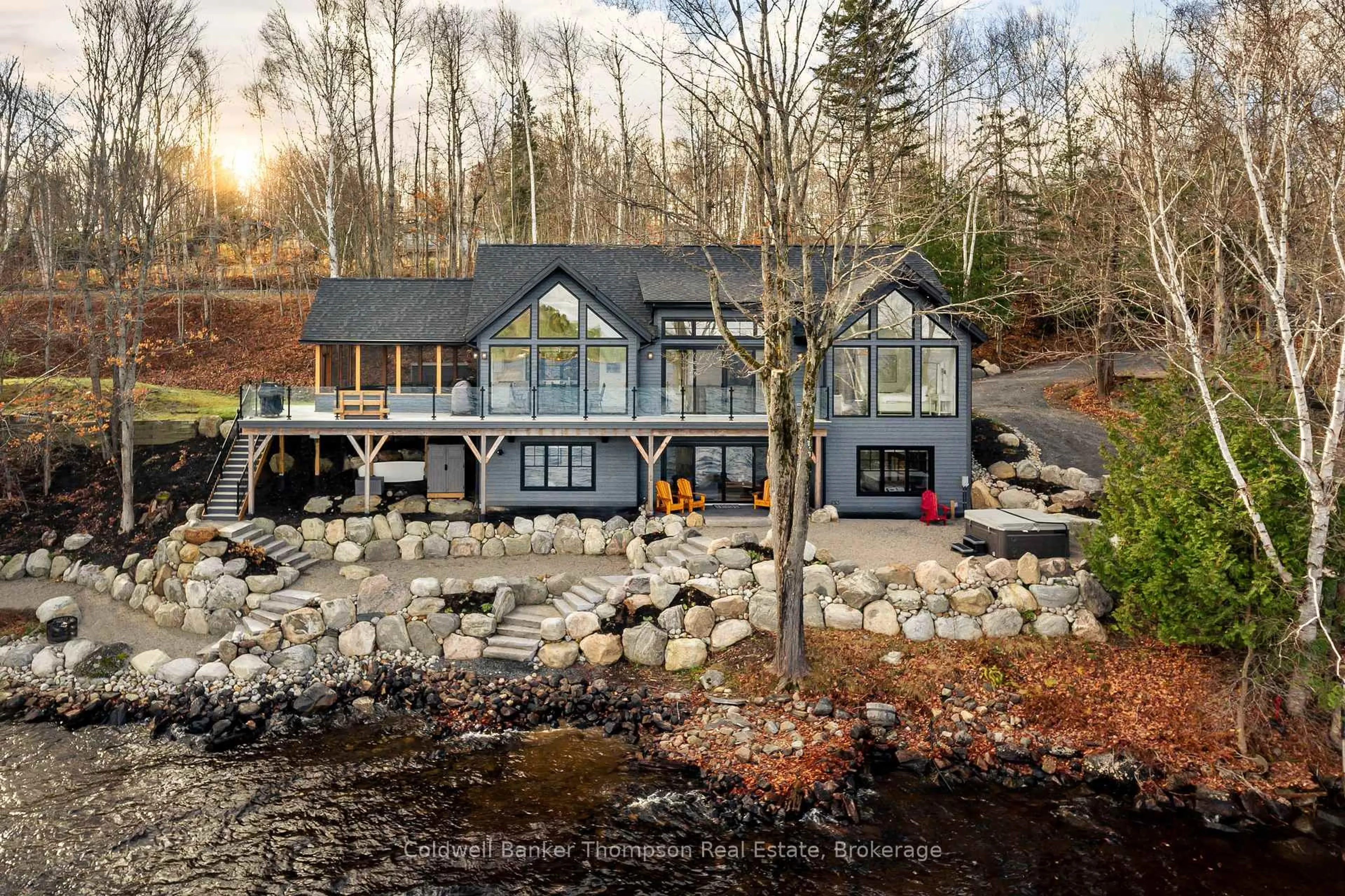 A pic from outside/outdoor area/front of a property/back of a property/a pic from drone, water/lake/river/ocean view for 161 Wilson Dr, Huntsville Ontario P1H 2J2