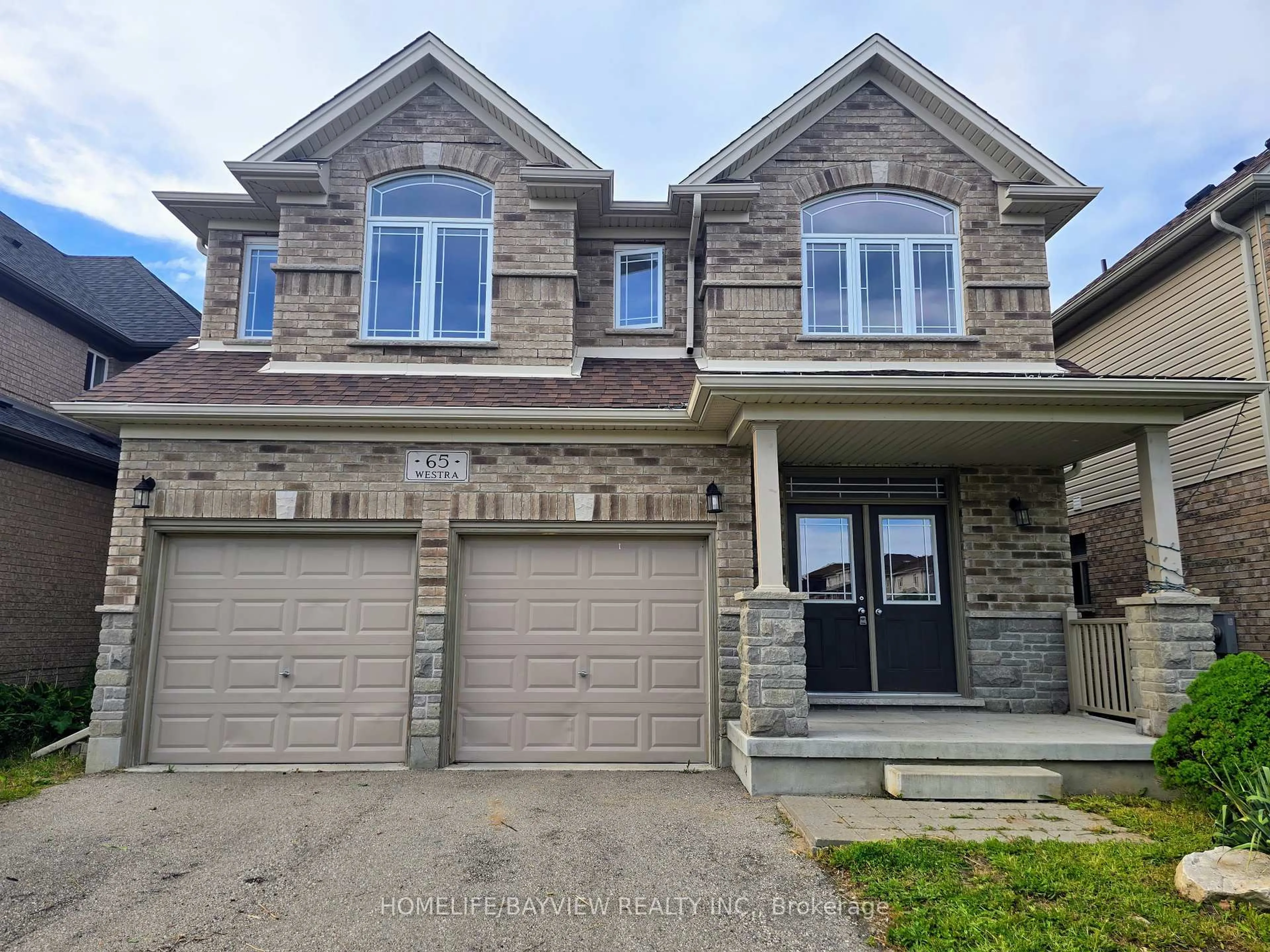 Home with brick exterior material, street for 65 Westra Dr, Guelph Ontario N1K 1Z7