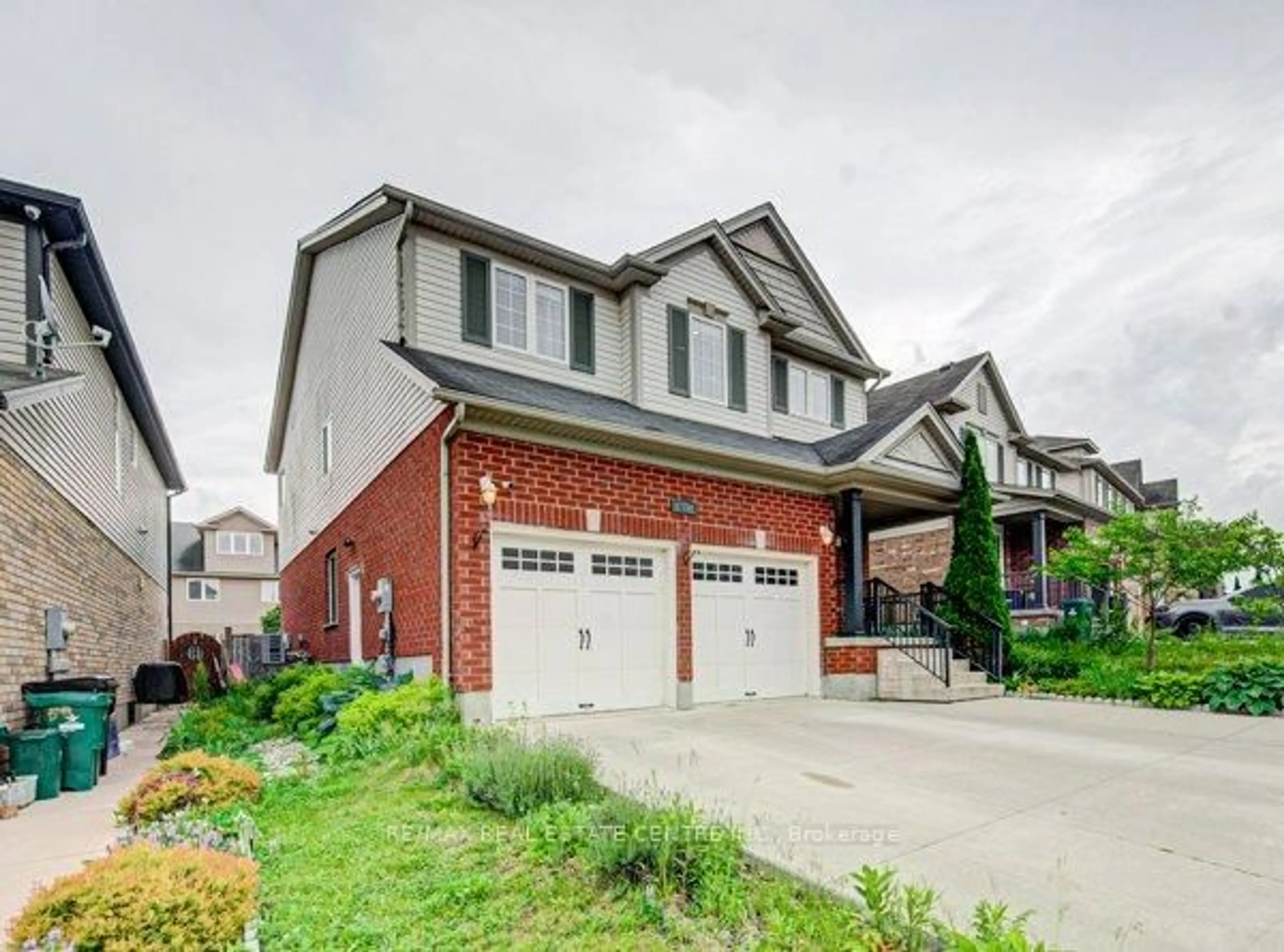 Home with brick exterior material, street for 55 Isaiah Dr, Kitchener Ontario N2E 0B2