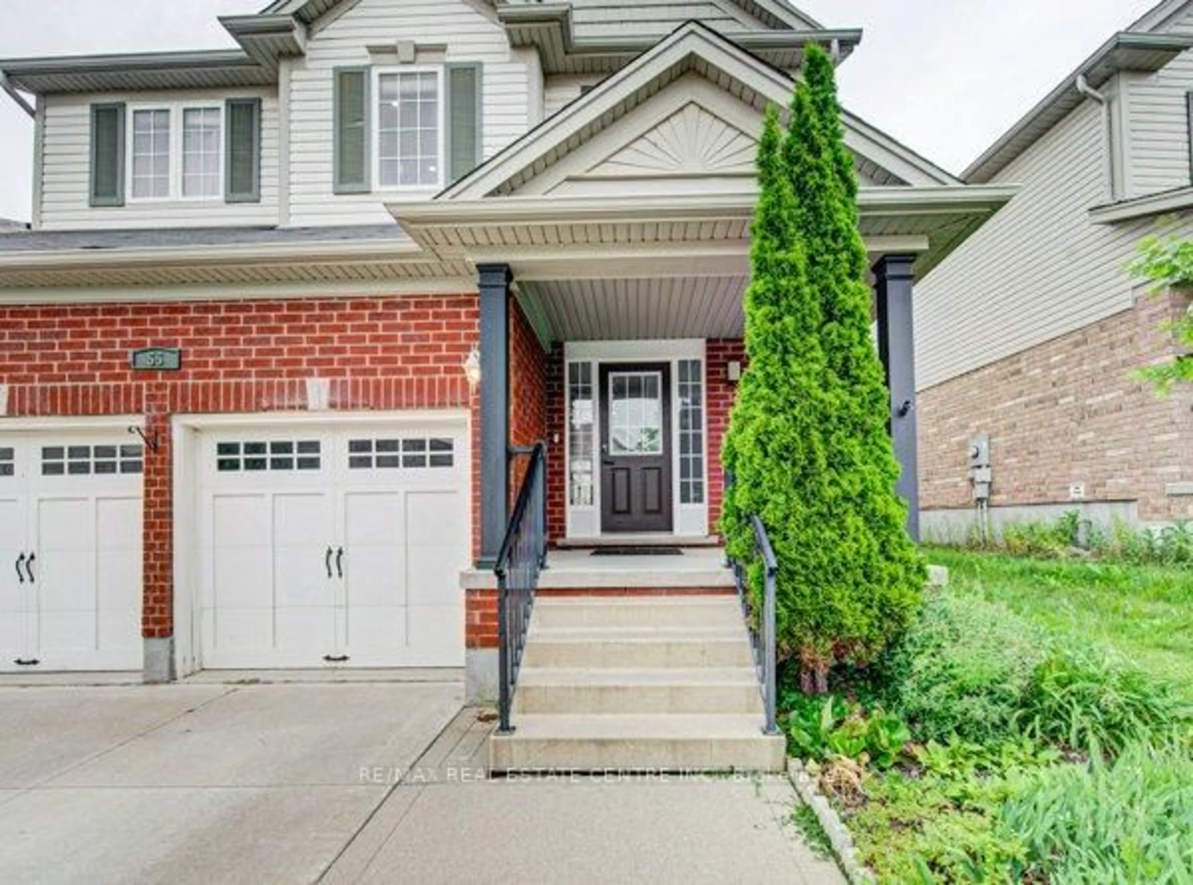 Home with brick exterior material, street for 55 Isaiah Dr, Kitchener Ontario N2E 0B2