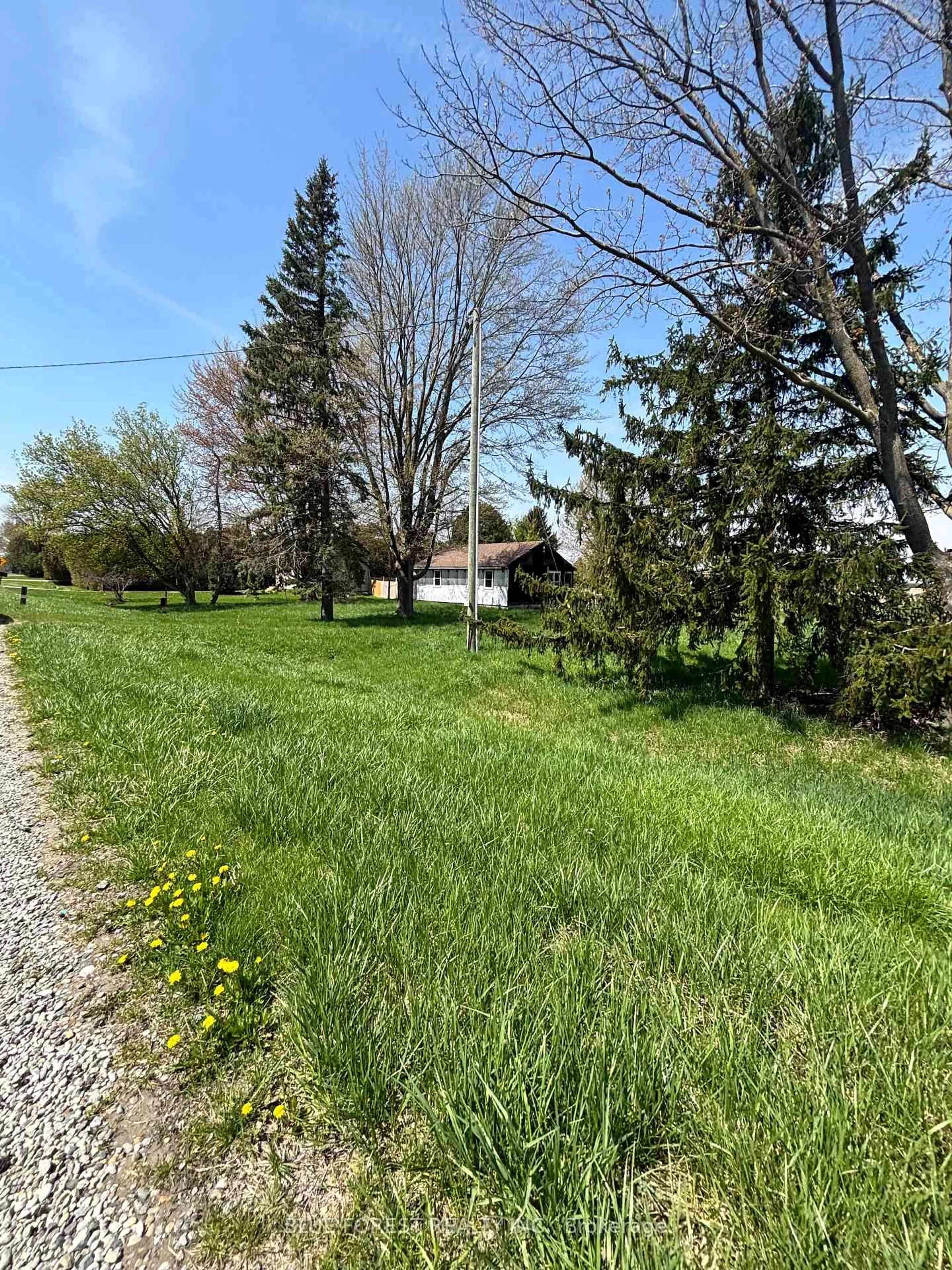 A pic from outside/outdoor area/front of a property/back of a property/a pic from drone, street for 12003 Baseline Rd, Chatham-Kent Ontario N0P 2K0