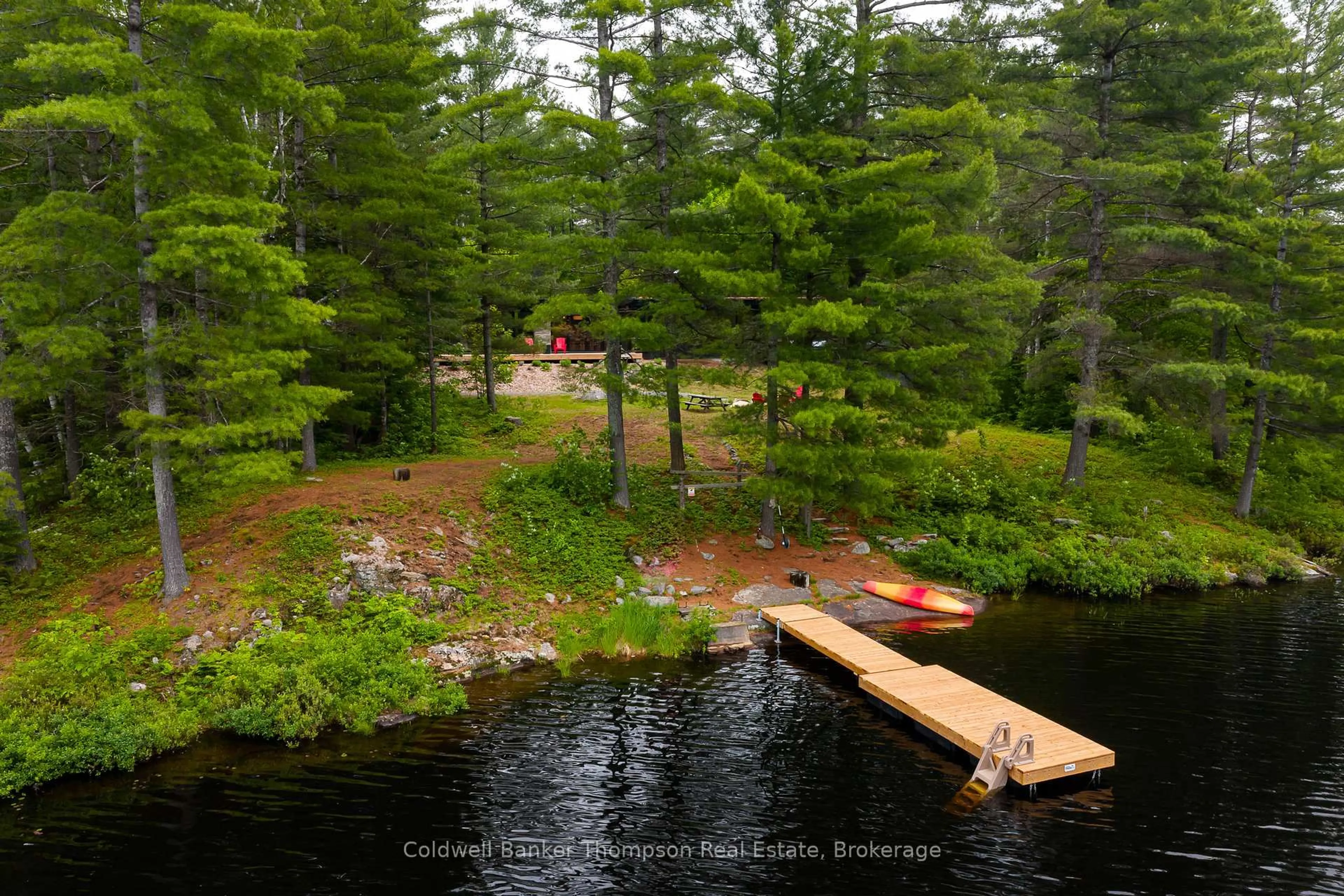 A pic from outside/outdoor area/front of a property/back of a property/a pic from drone, water/lake/river/ocean view for 1558 South Lancelot Rd, Huntsville Ontario P0B 1M0