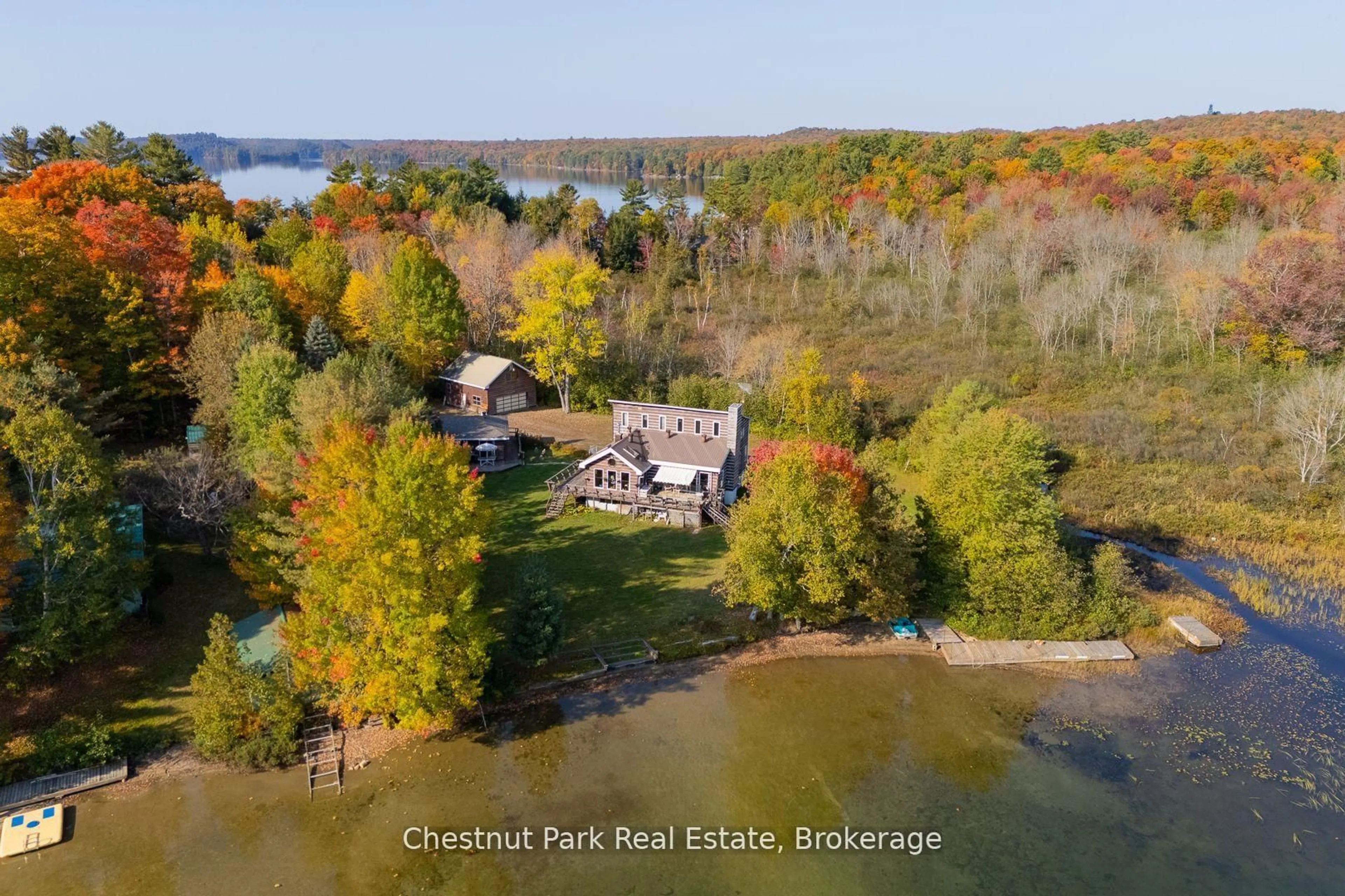 A pic from outside/outdoor area/front of a property/back of a property/a pic from drone, water/lake/river/ocean view for 170 Long Point Rd, Huntsville Ontario P0B 1M0