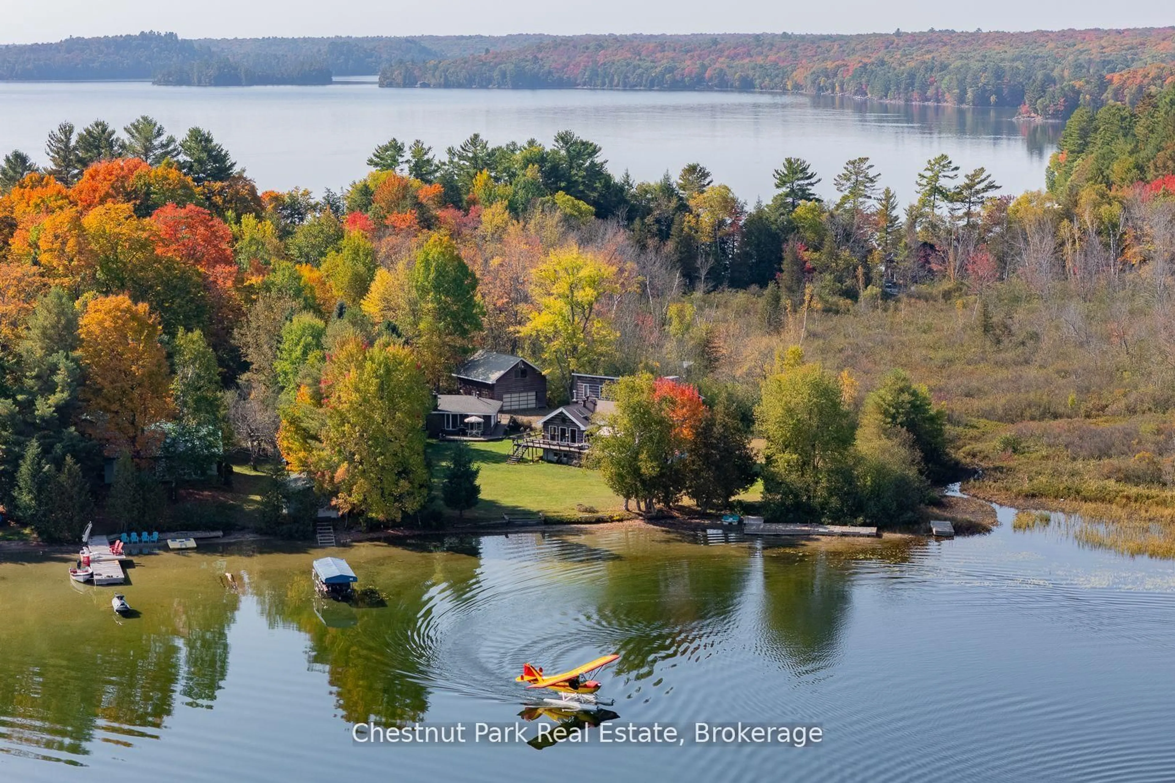A pic from outside/outdoor area/front of a property/back of a property/a pic from drone, water/lake/river/ocean view for 170 Long Point Rd, Huntsville Ontario P0B 1M0