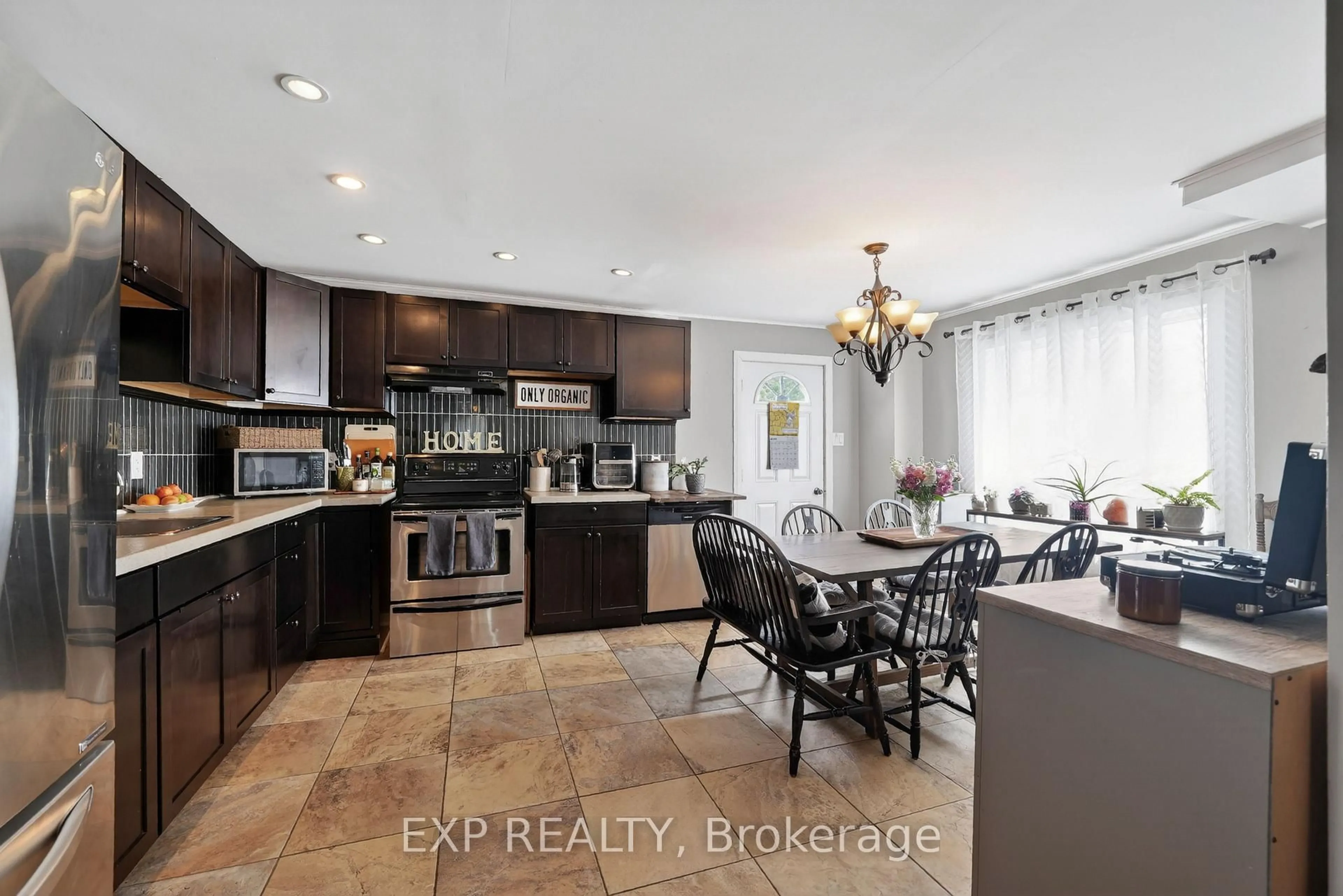 Open concept kitchen, ceramic/tile floor for 227 St Felix St, Cornwall Ontario K6H 5A4