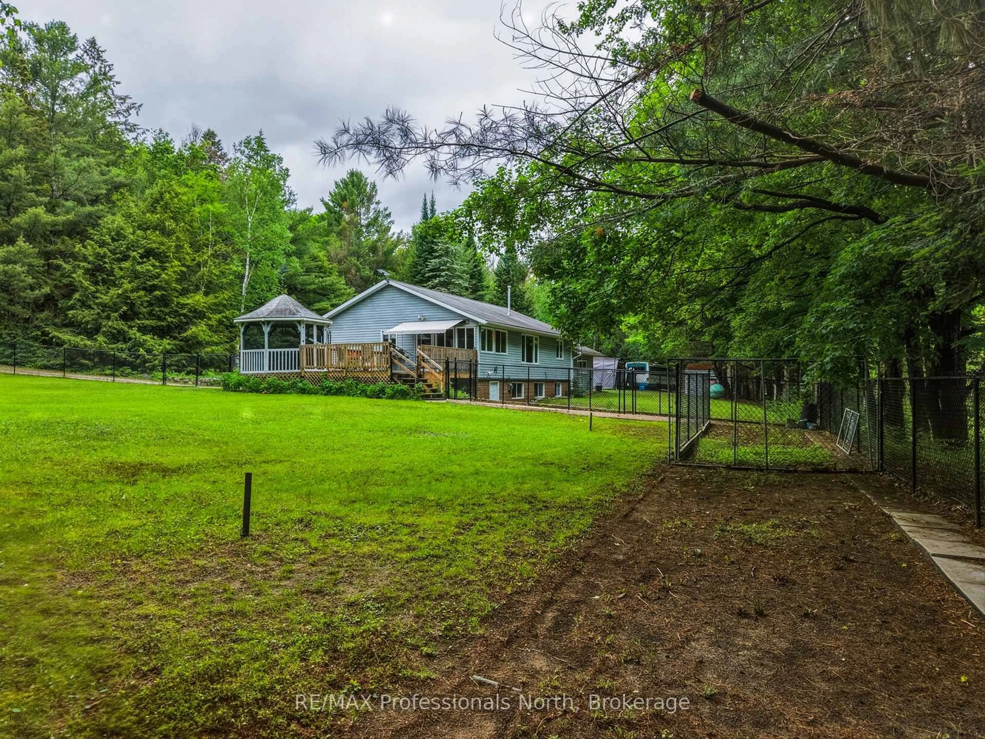 A pic from outside/outdoor area/front of a property/back of a property/a pic from drone, forest/trees view for 1020 COLONY Rd, Bracebridge Ontario P1L 1X3