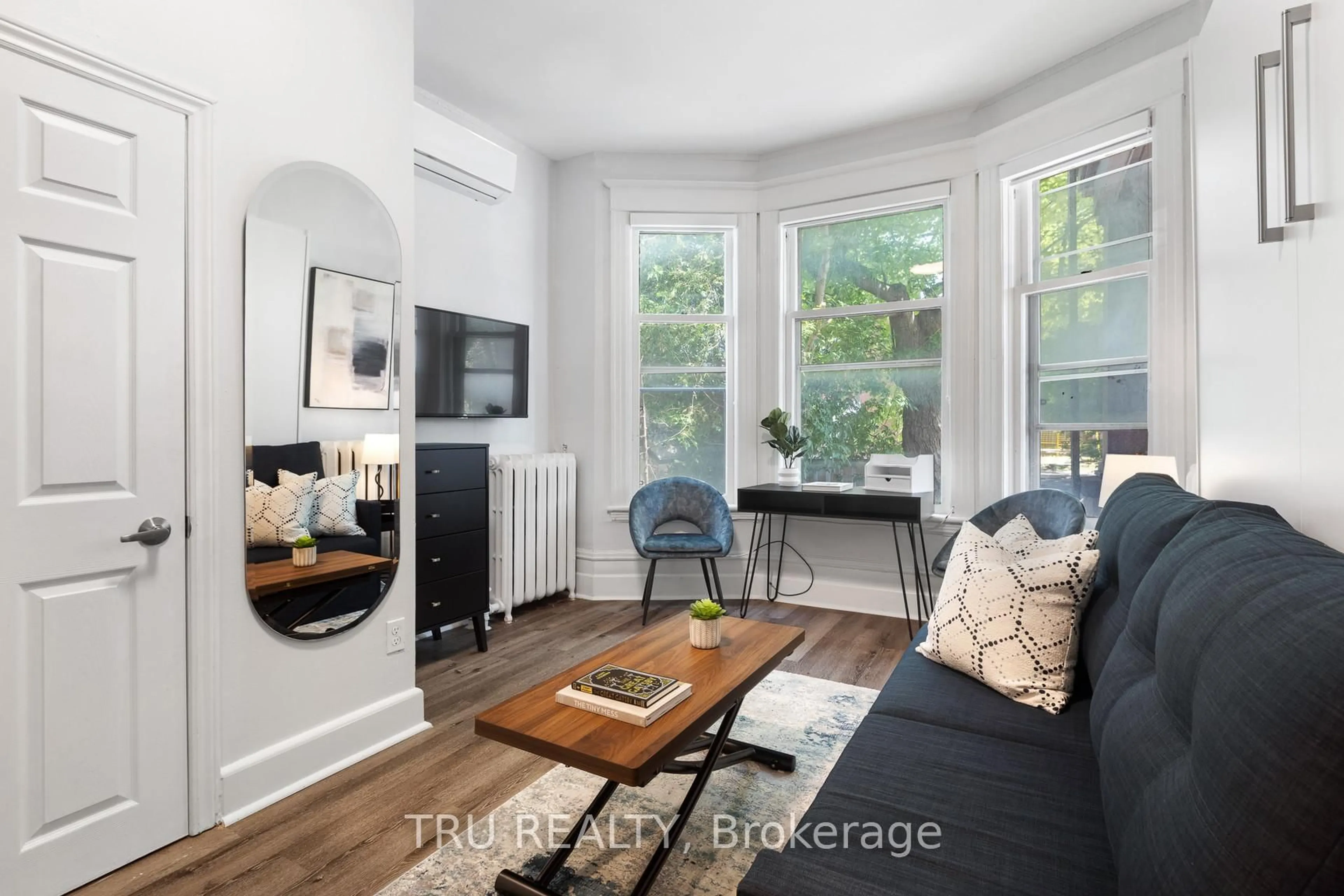 Living room with furniture, wood/laminate floor for 360 Friel St, Ottawa Ontario K1N 7W6