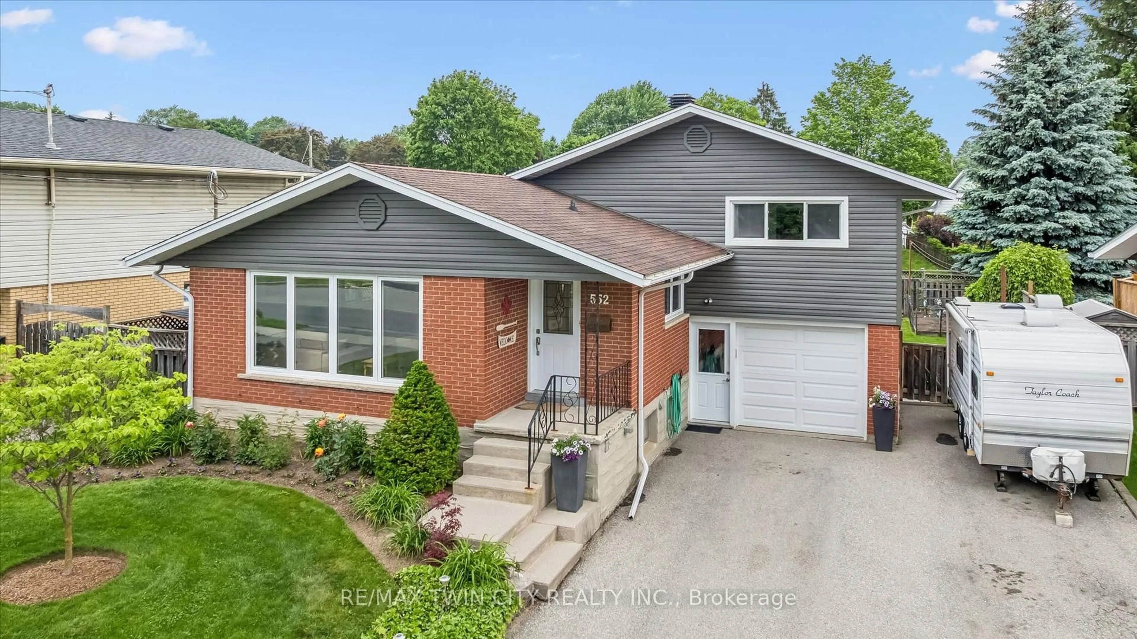 Home with brick exterior material, street for 552 Greenbrook Dr, Kitchener Ontario N2M 4K6