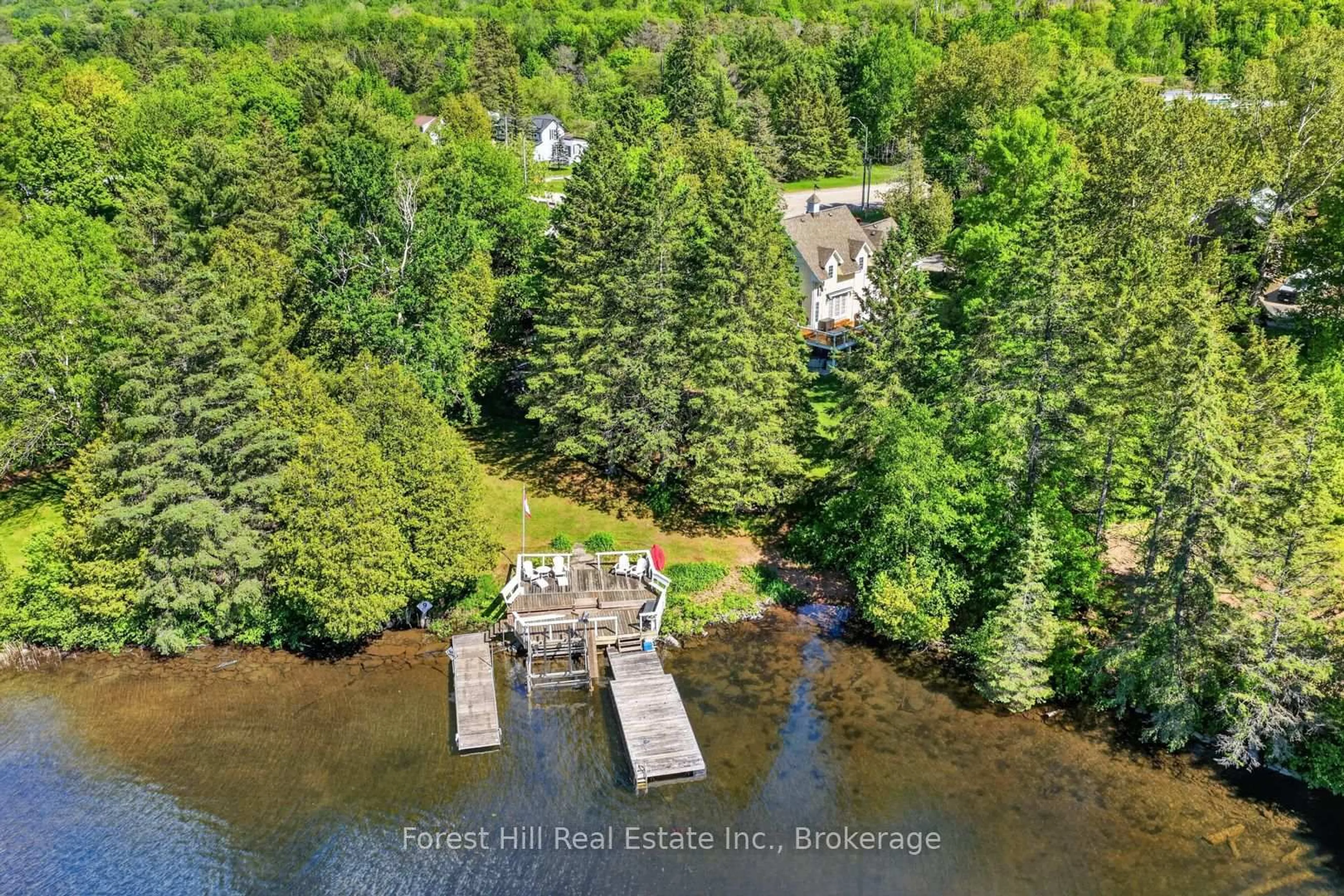 A pic from outside/outdoor area/front of a property/back of a property/a pic from drone, water/lake/river/ocean view for 1029 Harvey Ave, Algonquin Highlands Ontario P0A 1E0