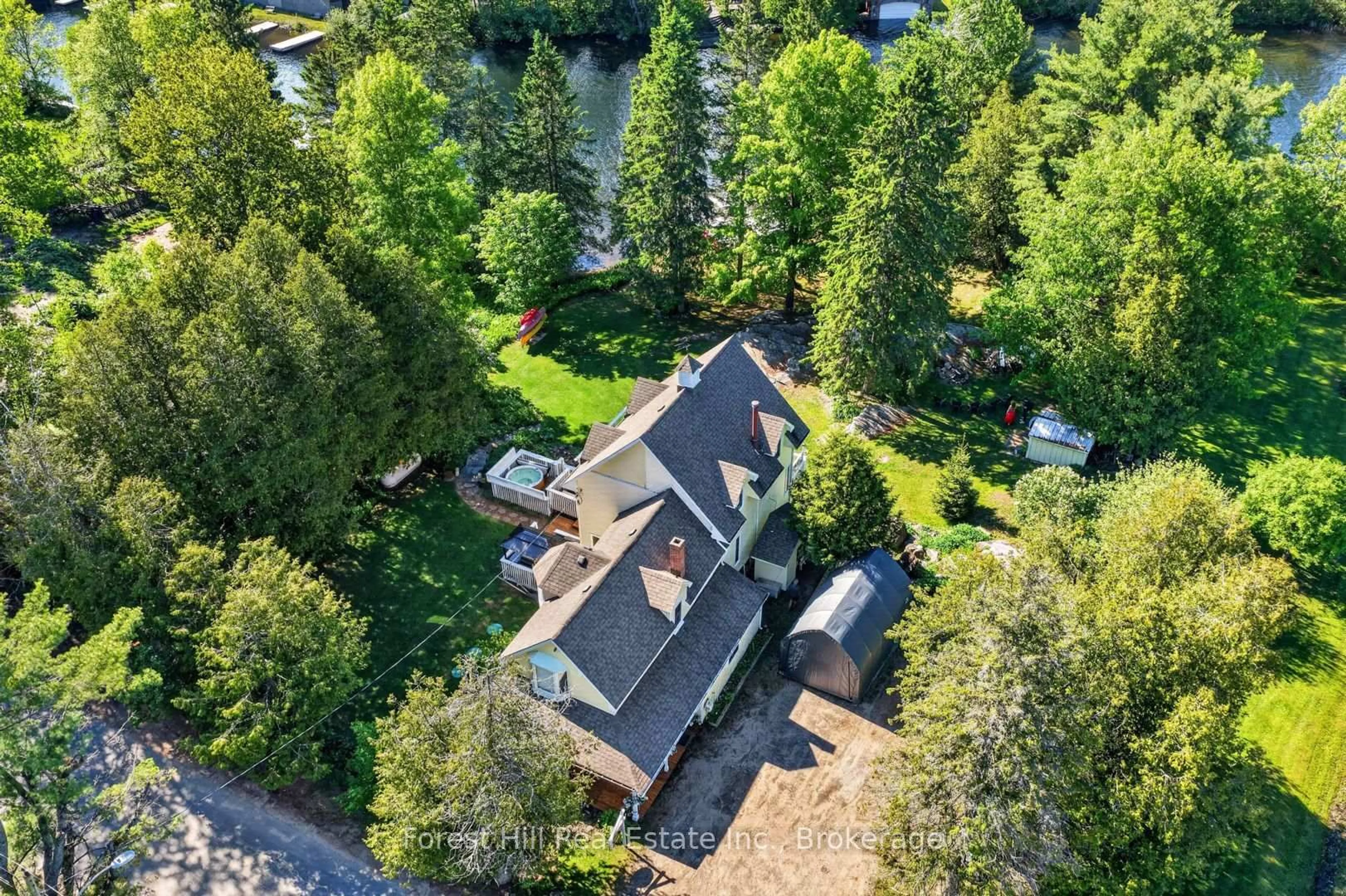 A pic from outside/outdoor area/front of a property/back of a property/a pic from drone, forest/trees view for 1029 Harvey Ave, Algonquin Highlands Ontario P0A 1E0