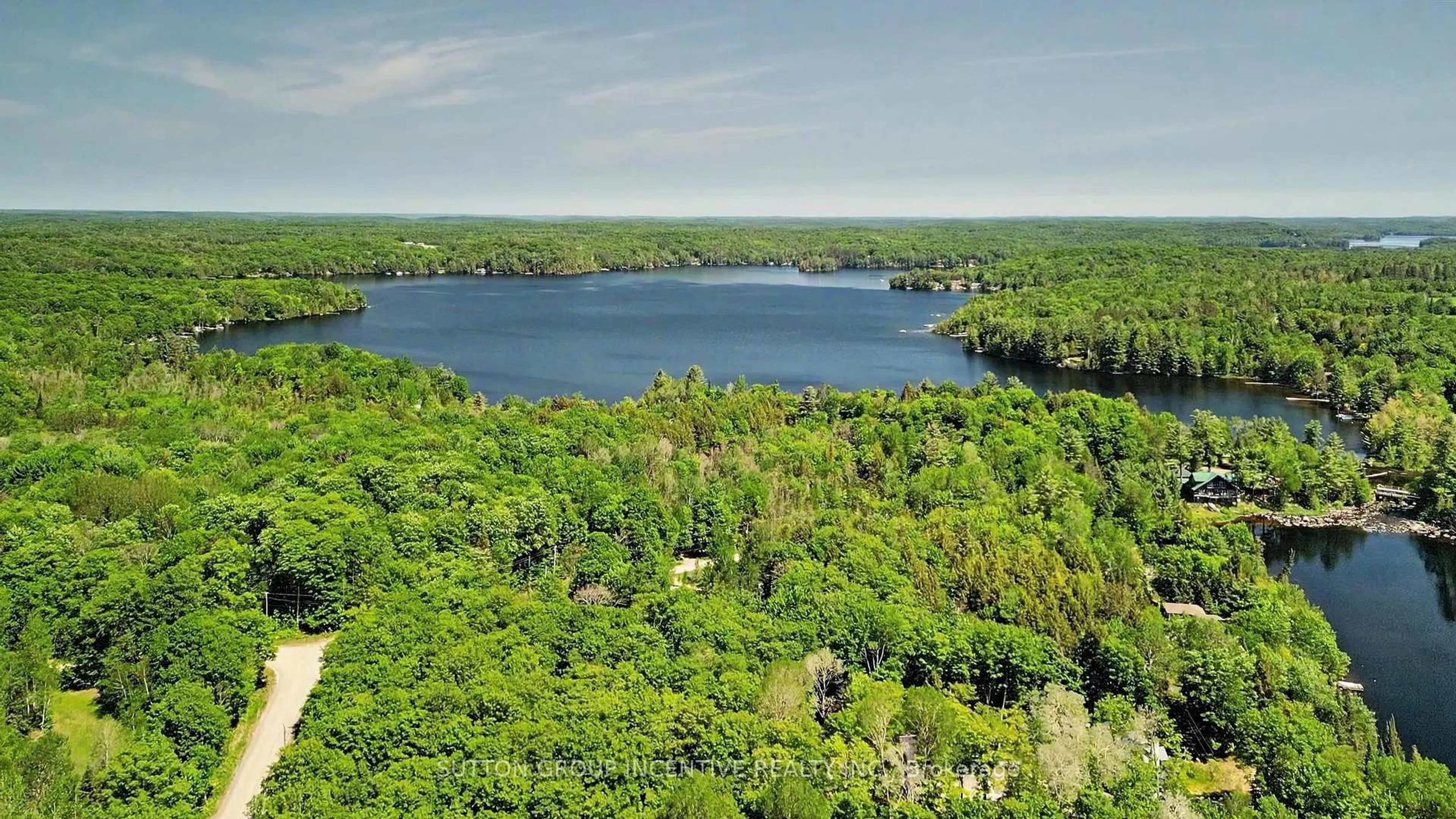 A pic from outside/outdoor area/front of a property/back of a property/a pic from drone, water/lake/river/ocean view for 1014 Scotts Dam Rd, Minden Hills Ontario K0M 2K0