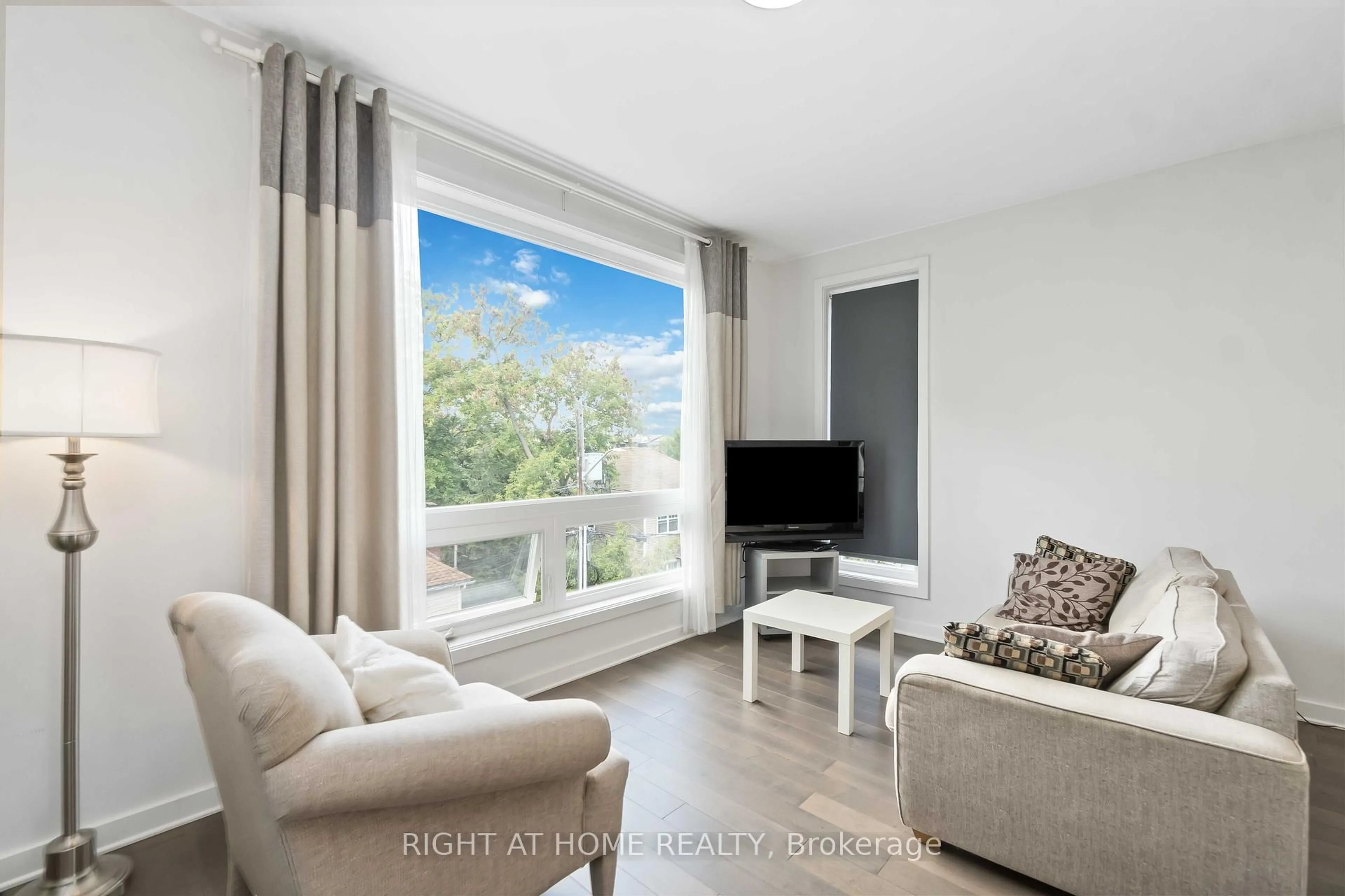 Living room with furniture, wood/laminate floor for 22 Perkins St #305, Ottawa Ontario K1R 7G5