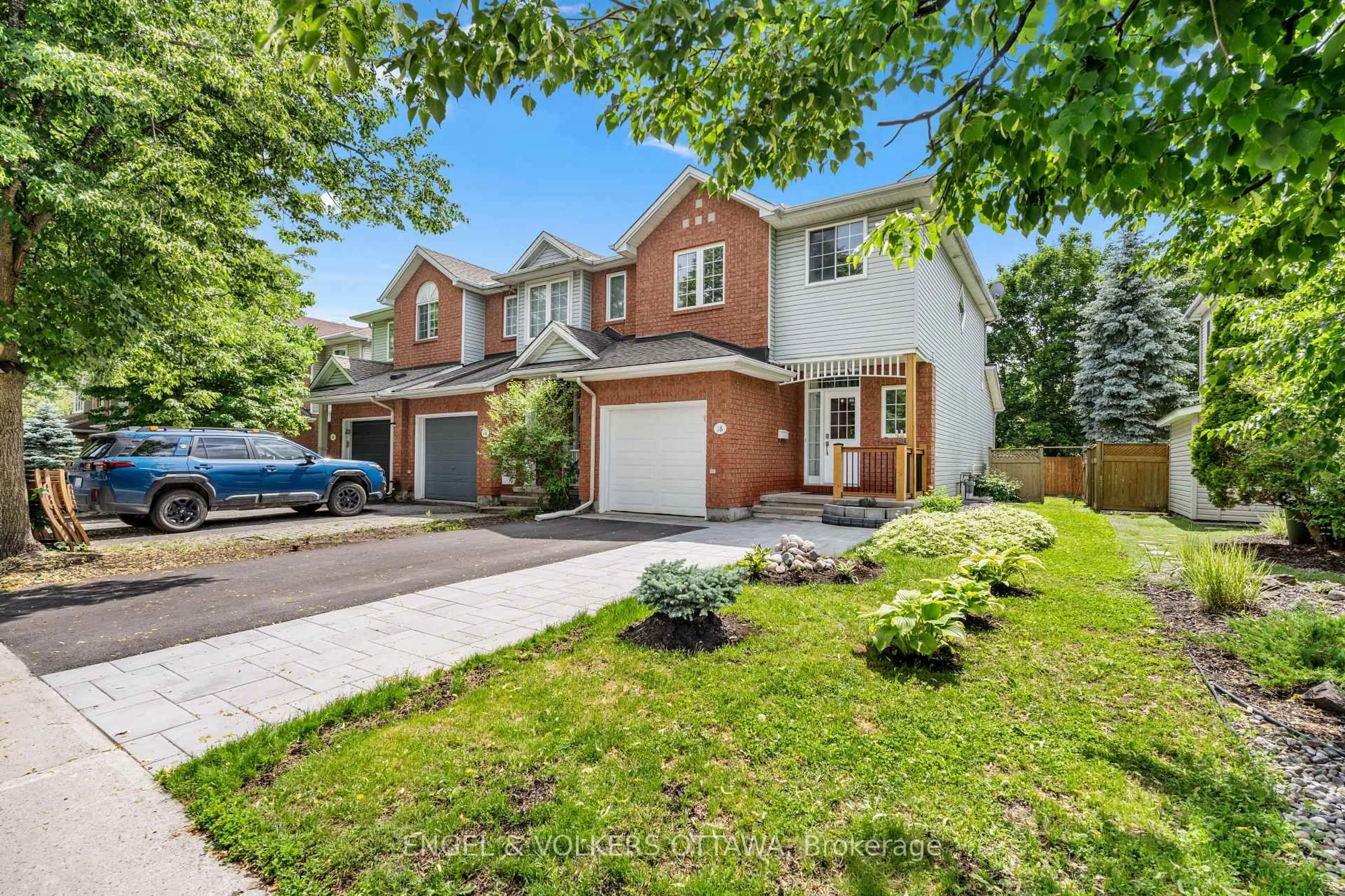 Home with brick exterior material, street for 18 Cambray Lane, Ottawa Ontario K2K 3C3