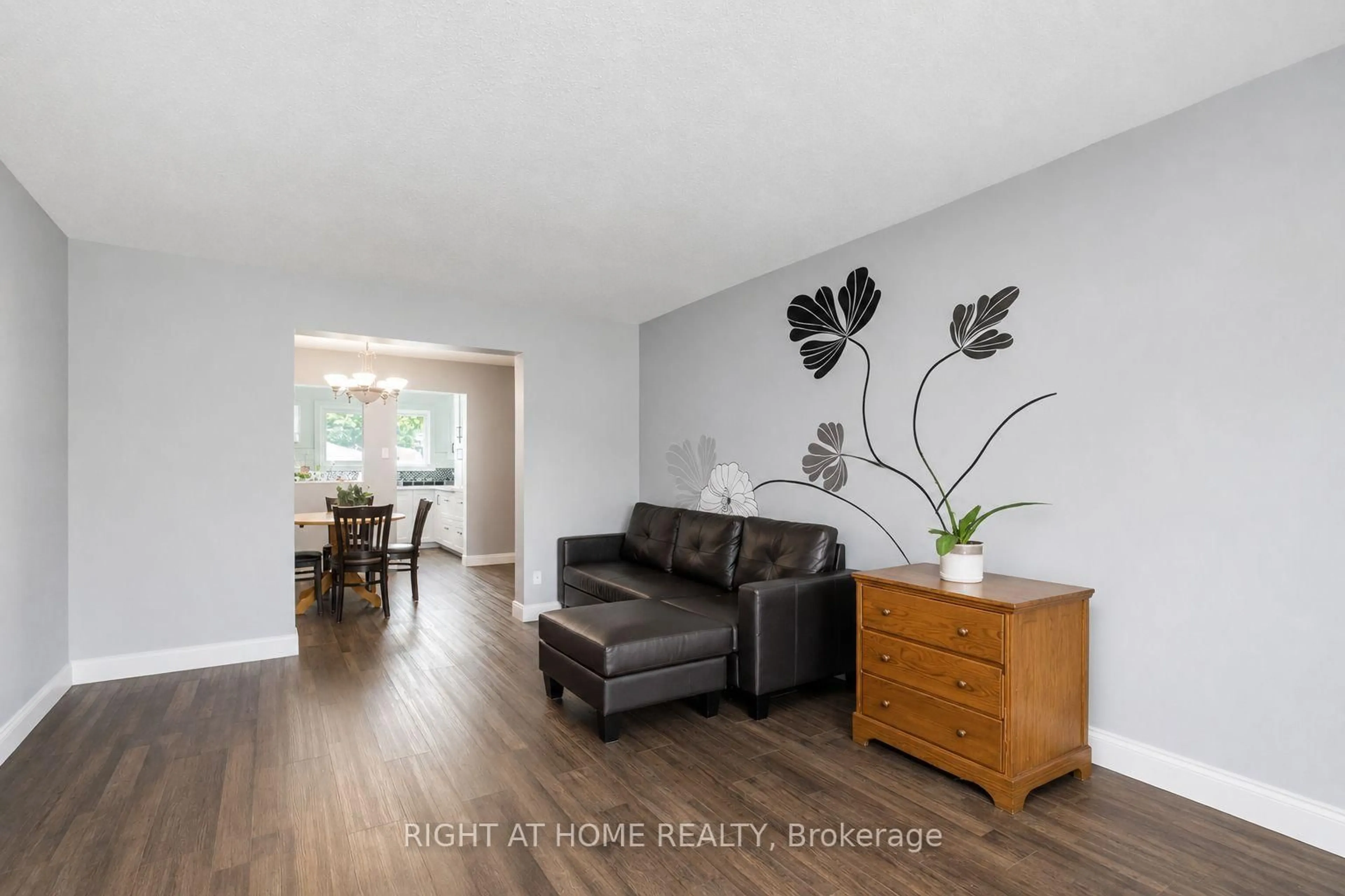 Living room with furniture, wood/laminate floor for 21 Midland Cres #3, Ottawa Ontario K2H 8P6