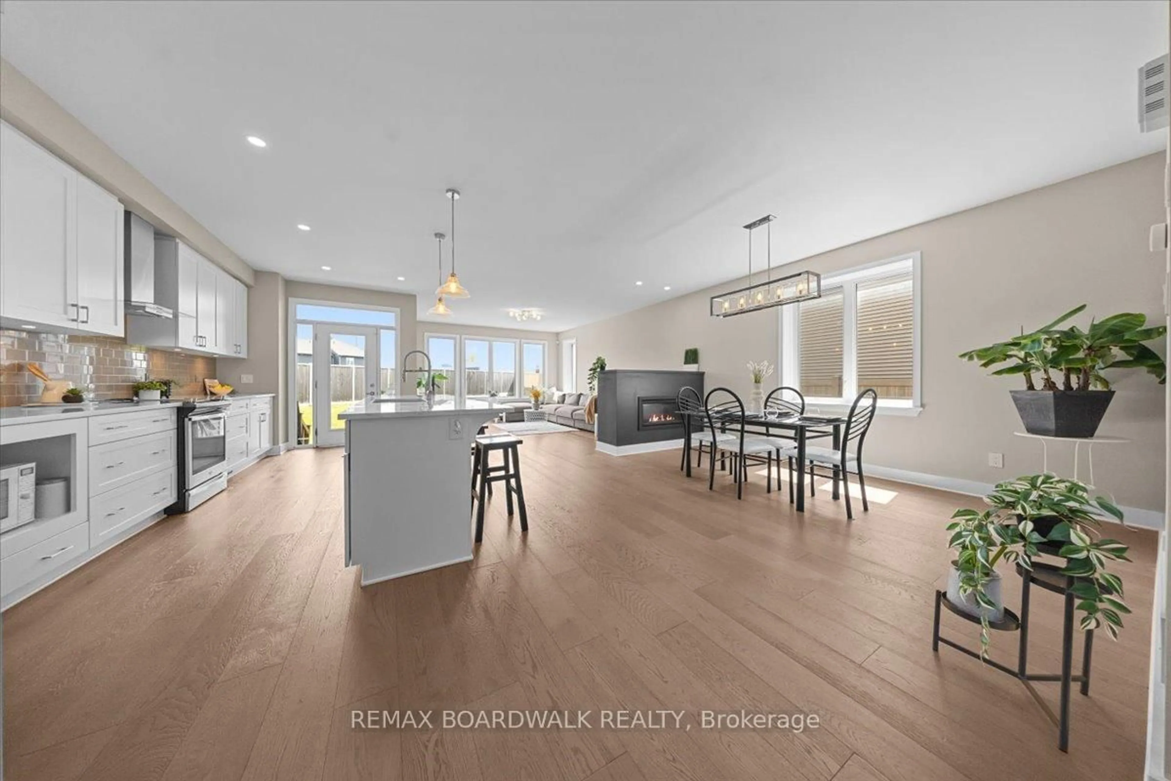 Open concept kitchen, wood/laminate floor for 620 Barry Helman Dr, Ottawa Ontario K2J 4S2