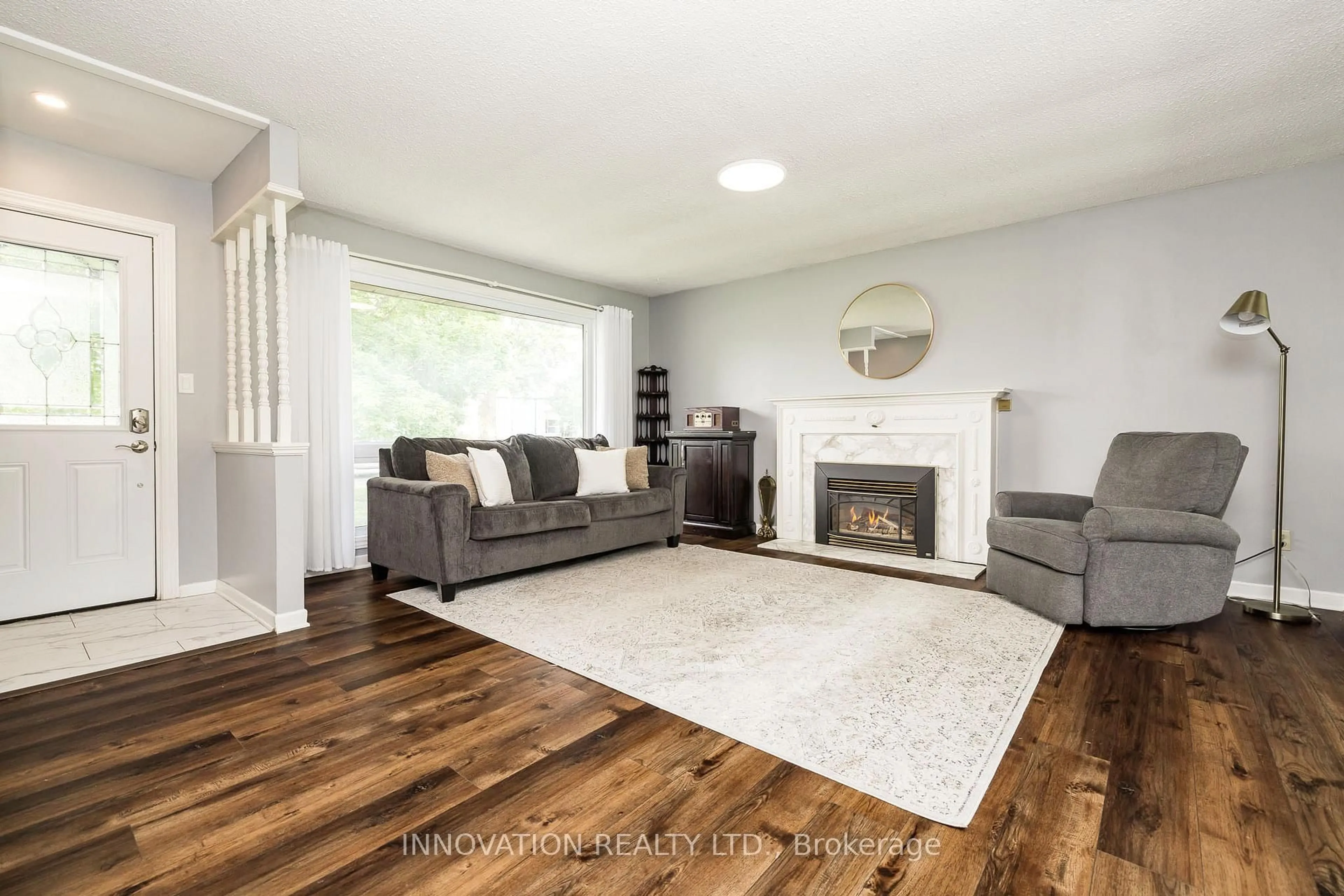 Living room with furniture, wood/laminate floor for 75 WILSON St, Perth Ontario K7H 2N7