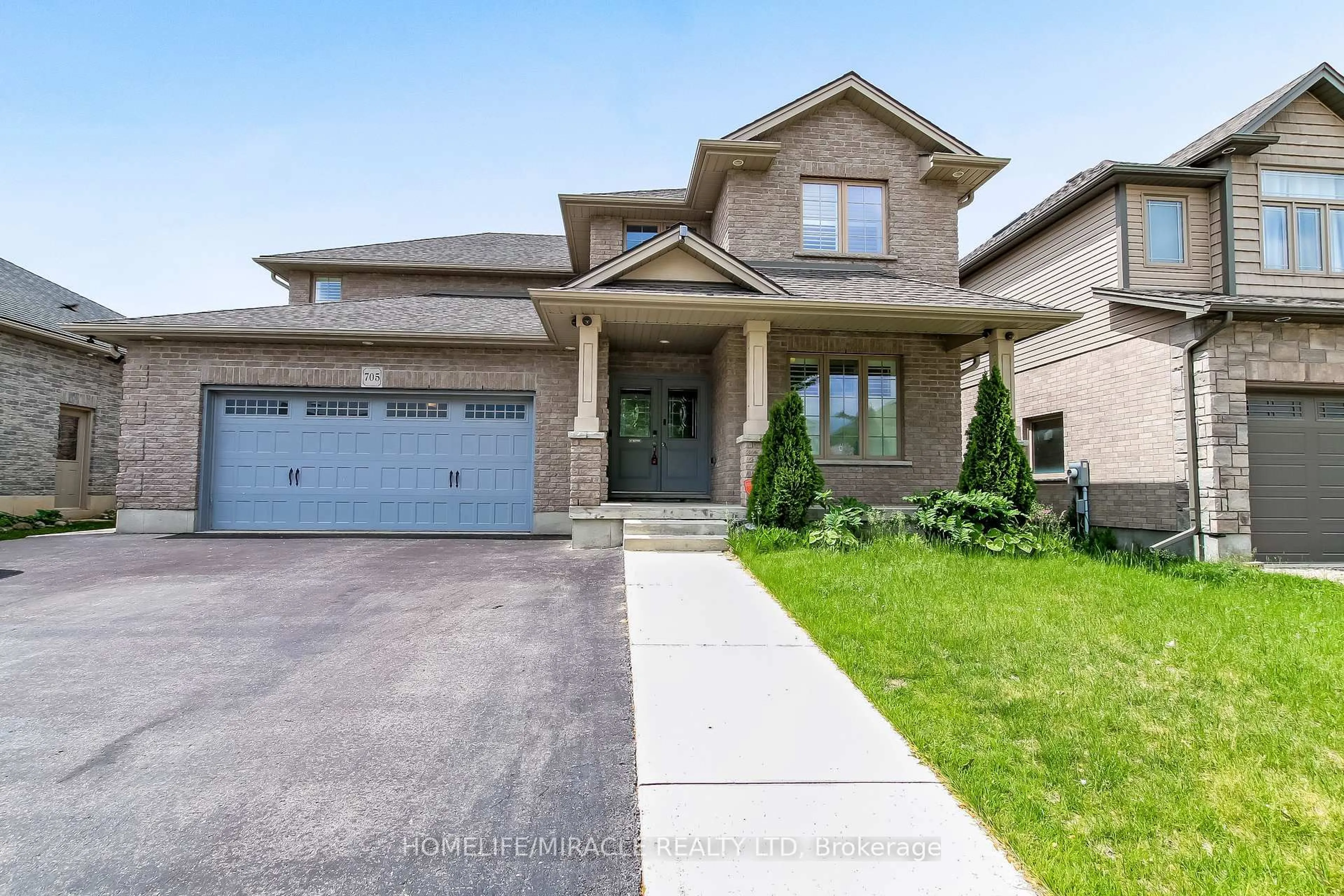 Home with brick exterior material, street for 705 Halifax Rd, Woodstock Ontario N4T 0C5