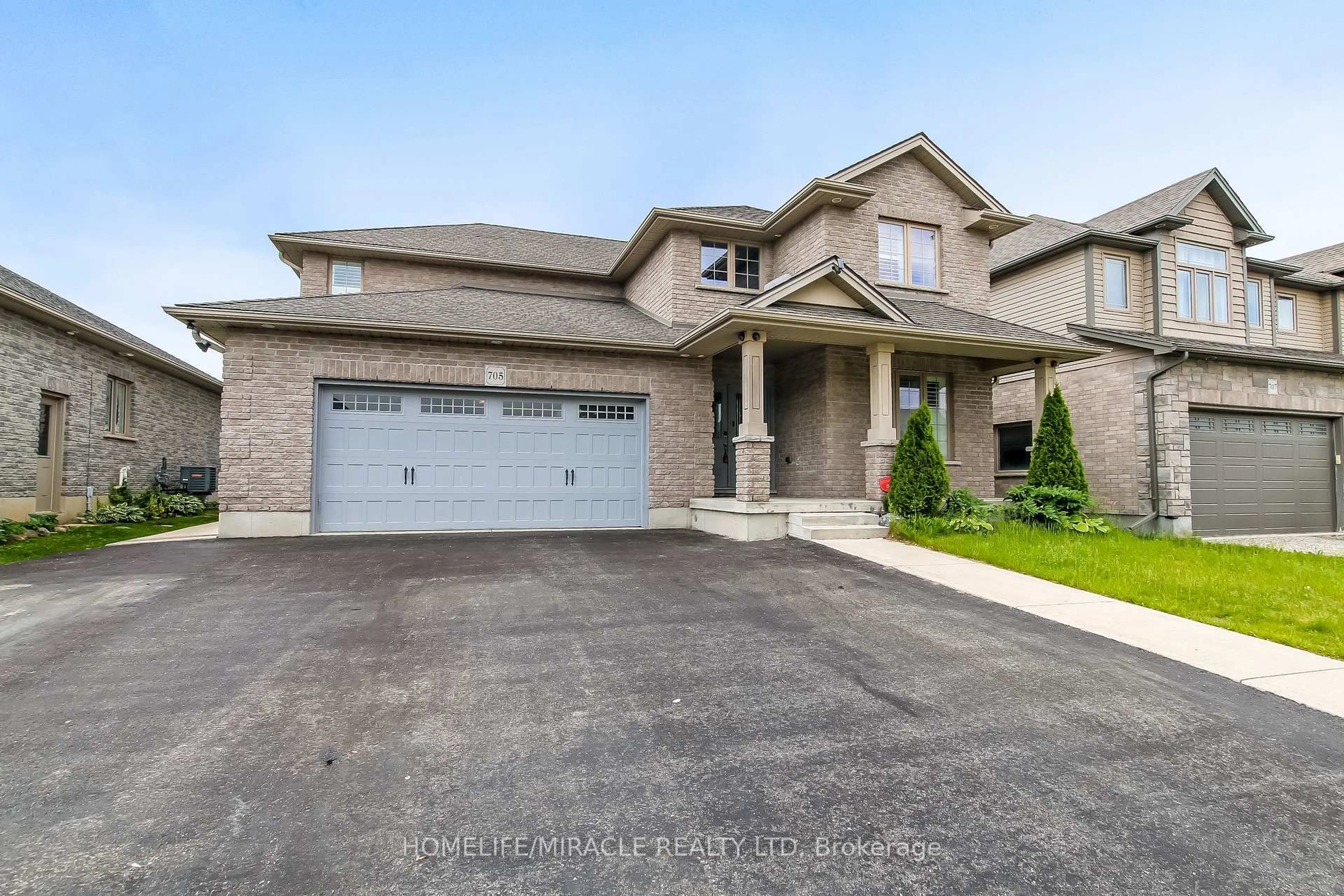 Home with brick exterior material, street for 705 Halifax Rd, Woodstock Ontario N4T 0C5