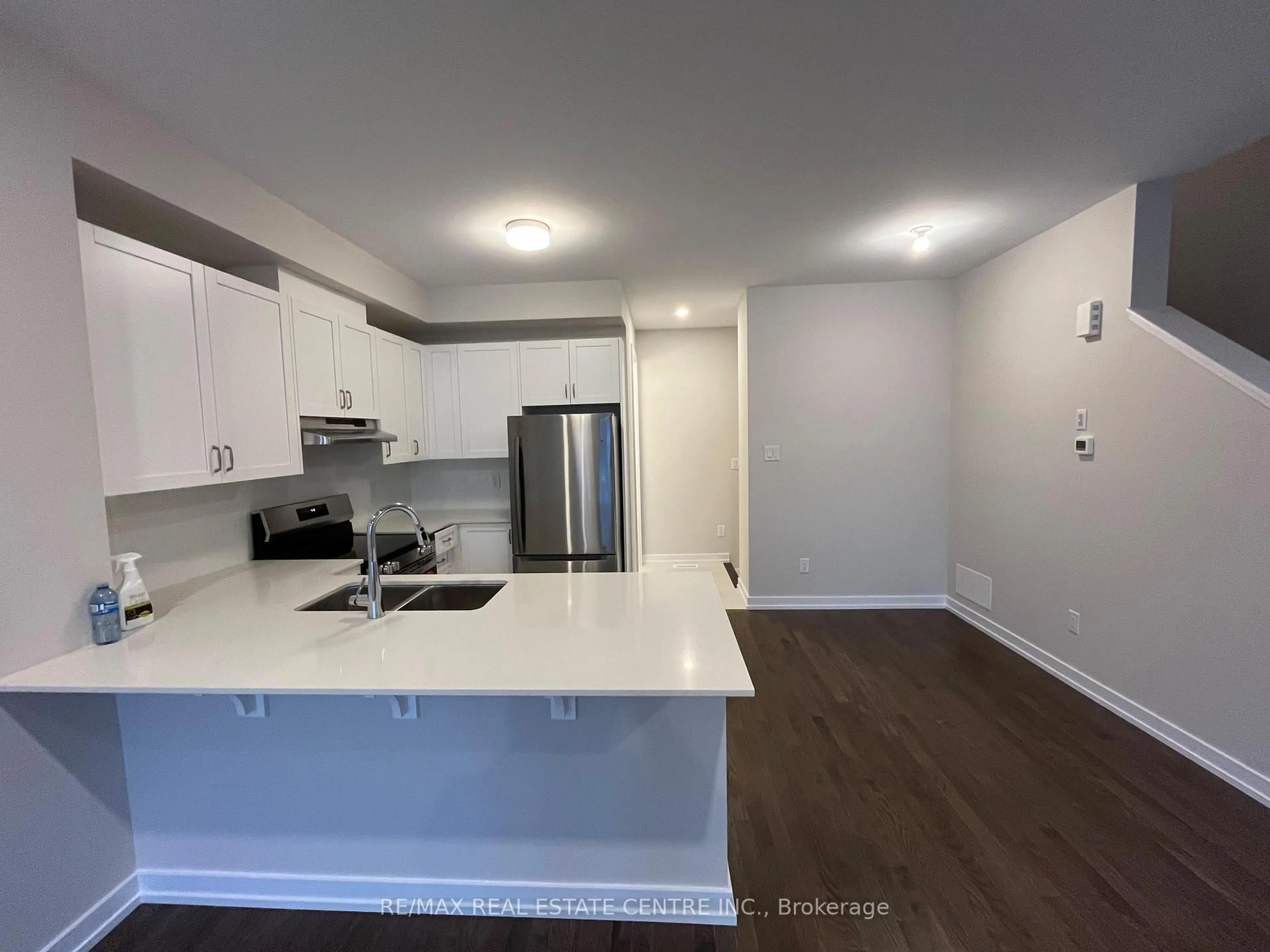 Open concept kitchen, wood/laminate floor for 540 Oldenburg Ave, Richmond Ontario K0A 2Z0