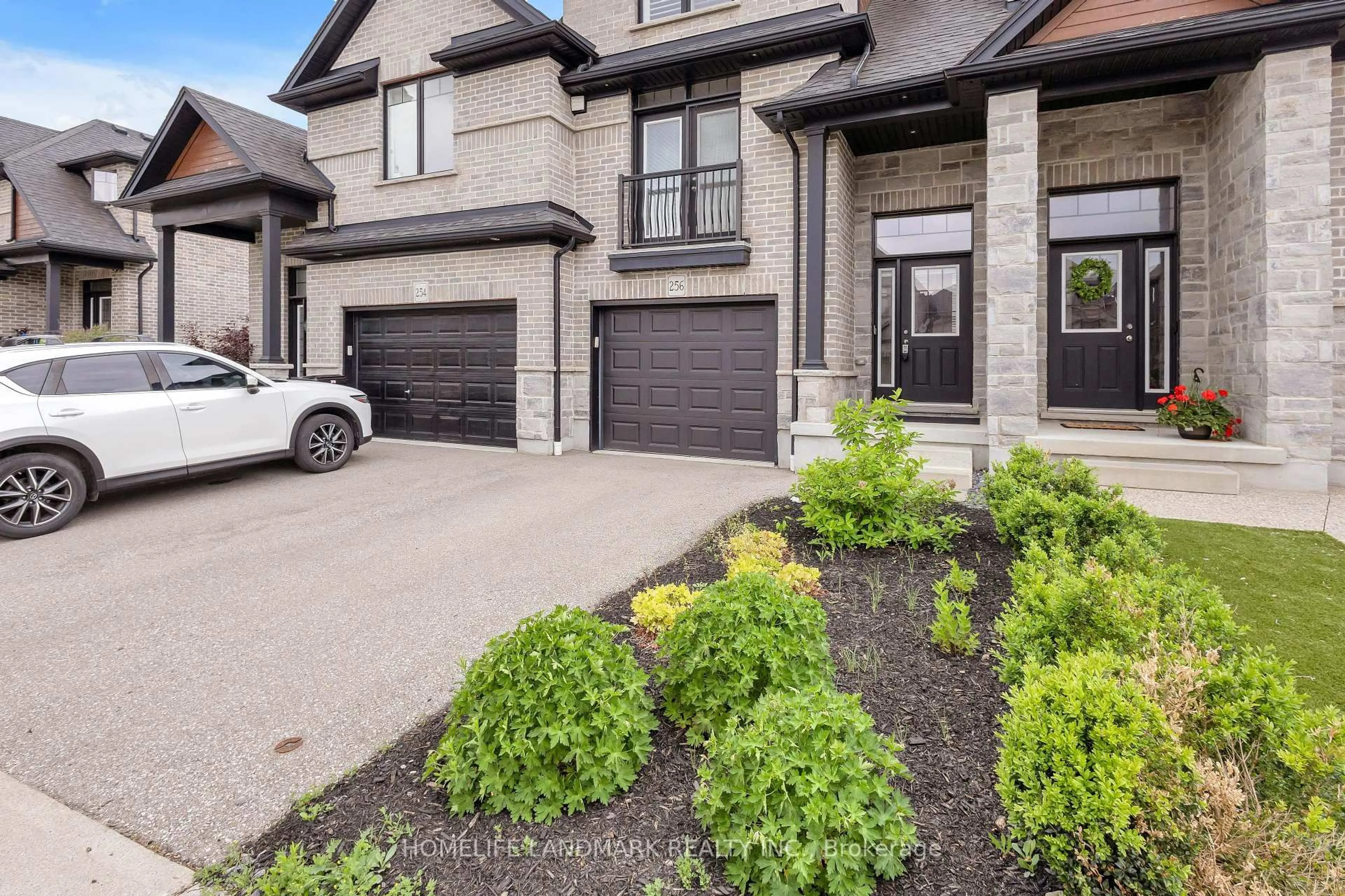 Home with brick exterior material, street for 256 FALCONRIDGE Dr, Kitchener Ontario N2K 0C5