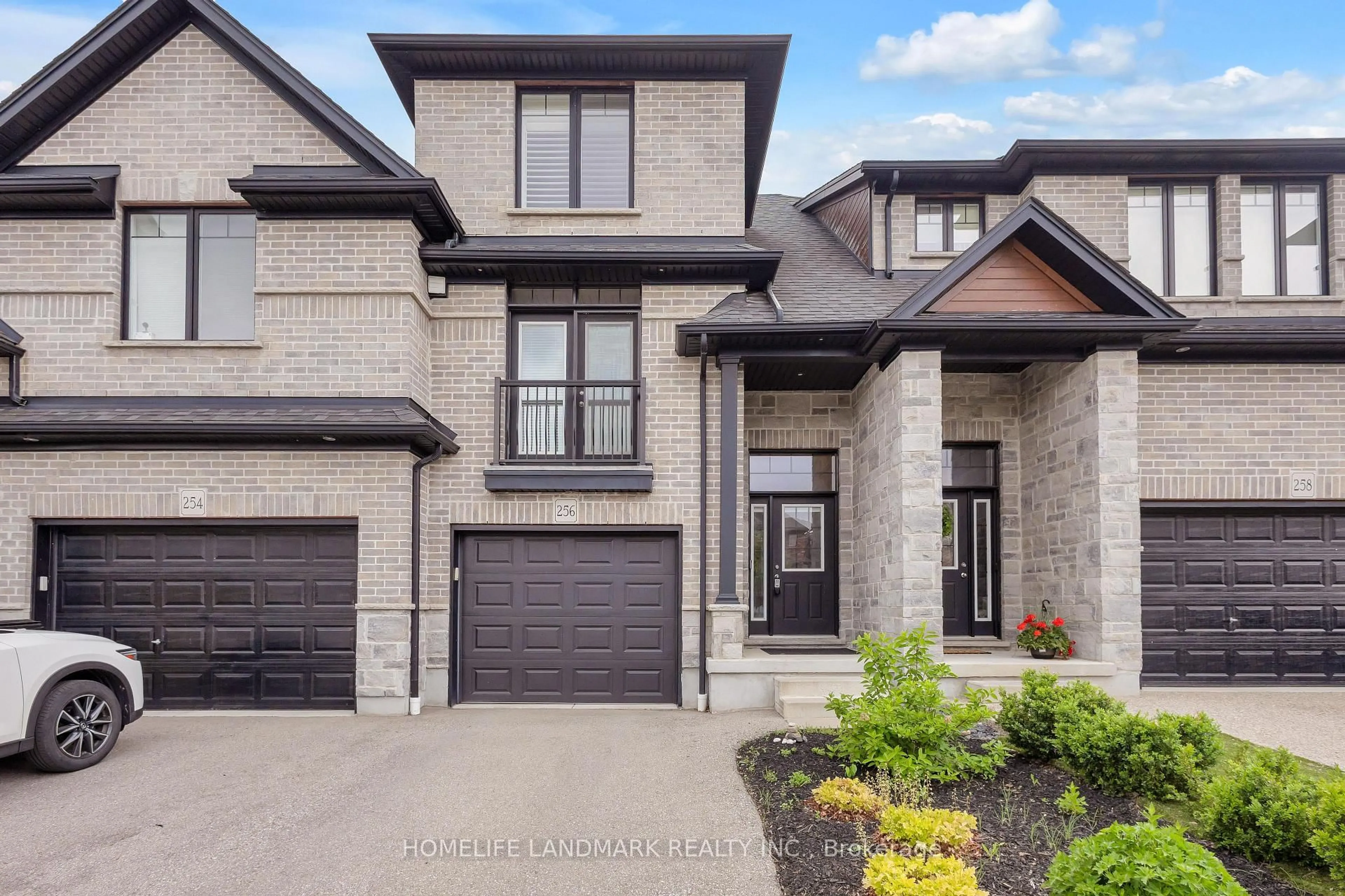 Home with brick exterior material, street for 256 FALCONRIDGE Dr, Kitchener Ontario N2K 0C5