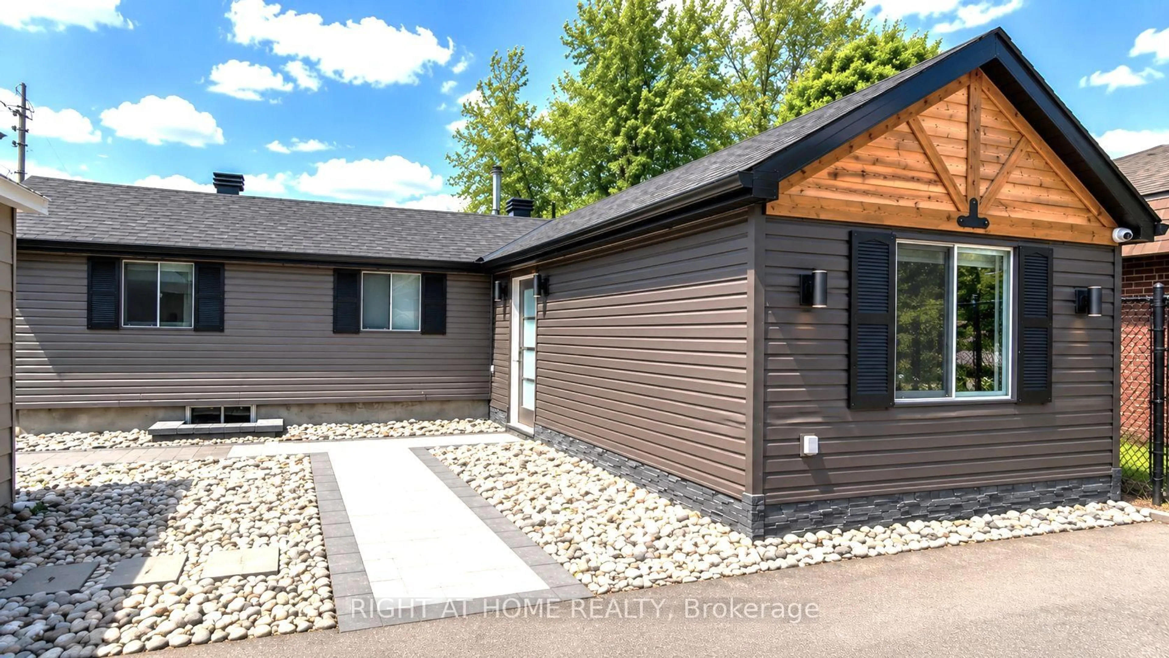 Home with vinyl exterior material, street for 3858 Rideau River Rd, North Grenville Ontario K0G 1J0