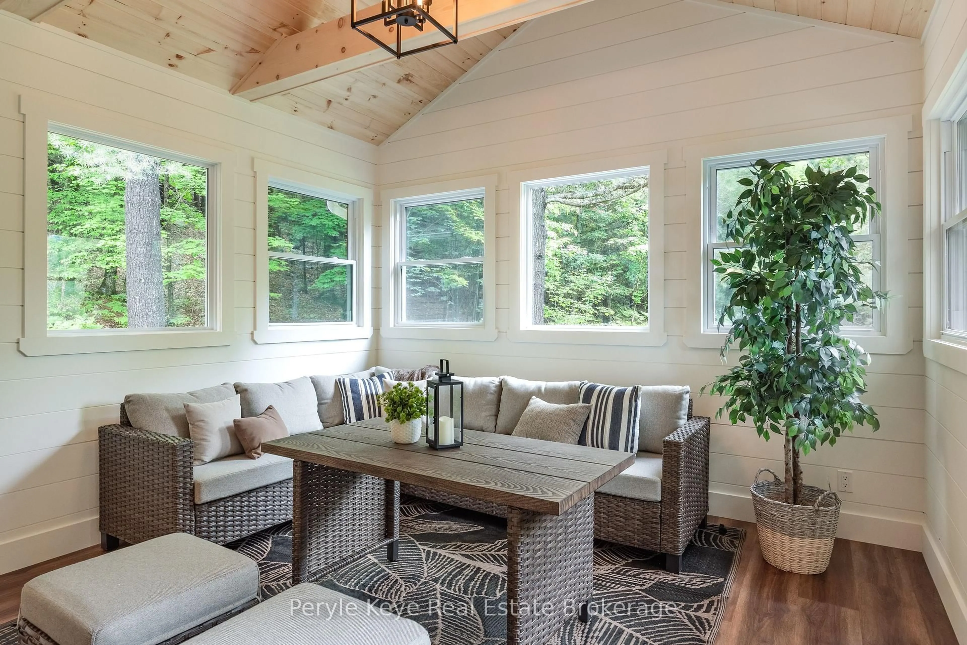 Living room with furniture, wood/laminate floor for 595 Clearwater Lake Rd, Huntsville Ontario P0B 1L0