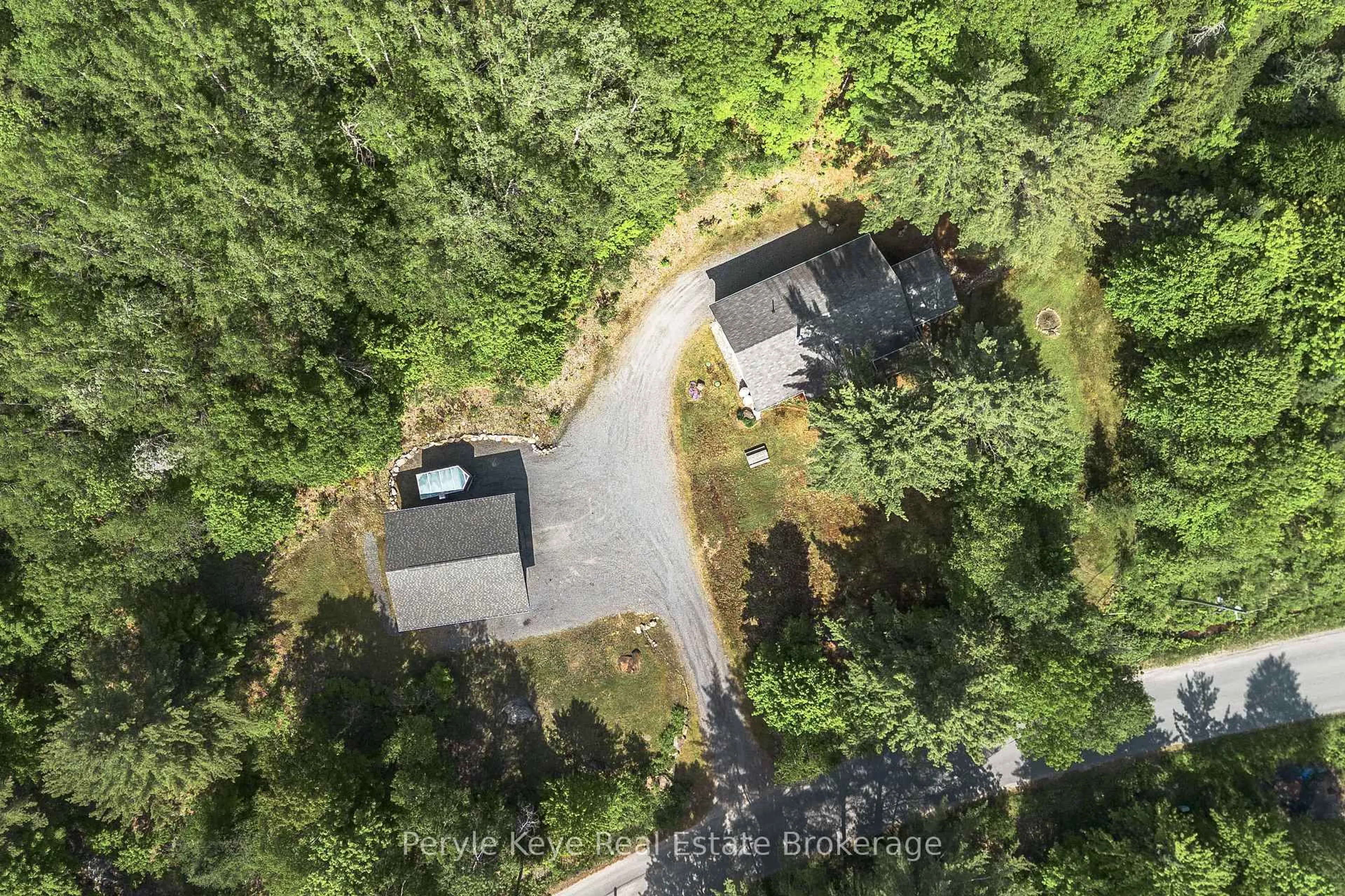 A pic from outside/outdoor area/front of a property/back of a property/a pic from drone, forest/trees view for 595 Clearwater Lake Rd, Huntsville Ontario P0B 1L0