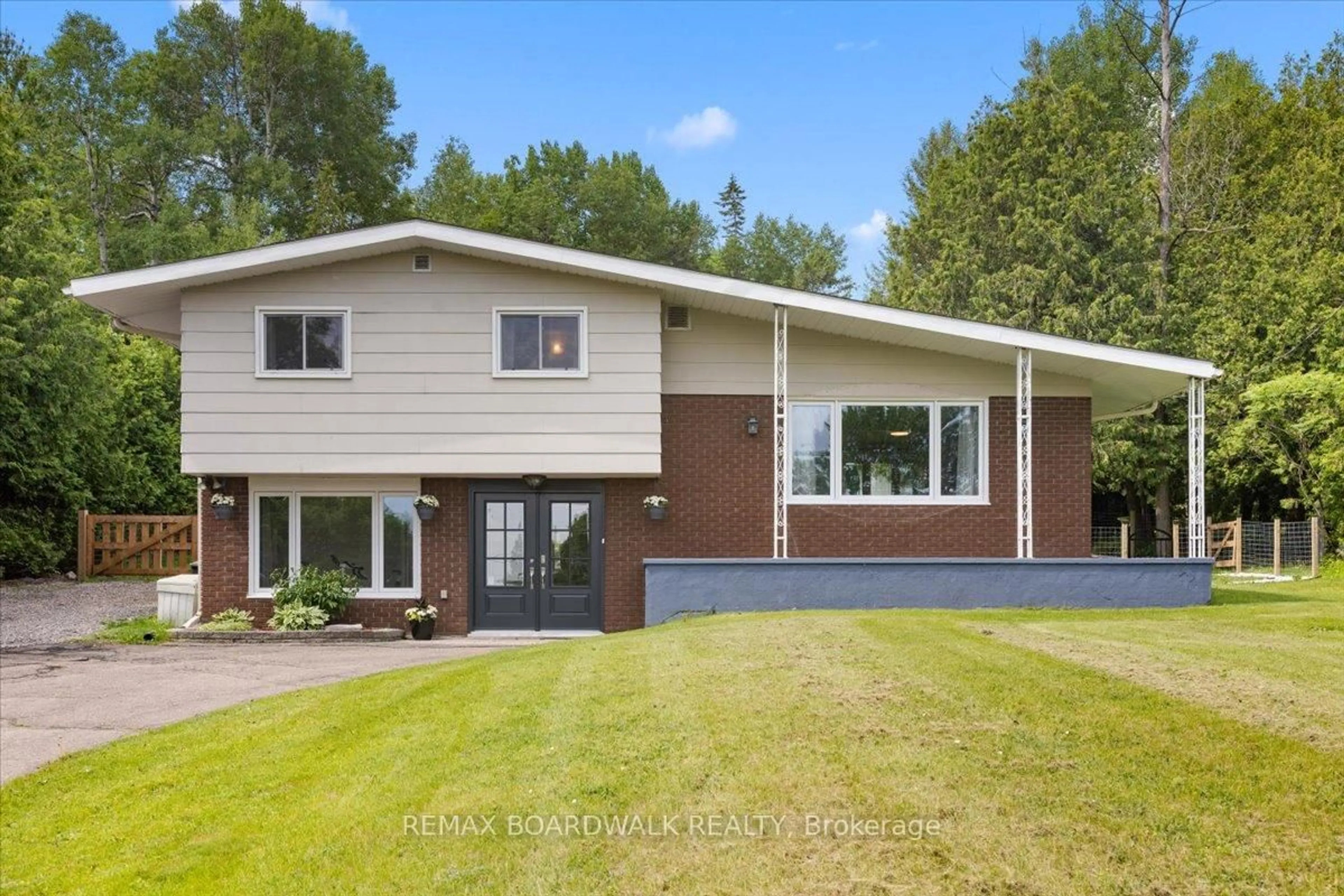 Home with vinyl exterior material, street for 1079 River Rd, Braeside Ontario K0A 1G0