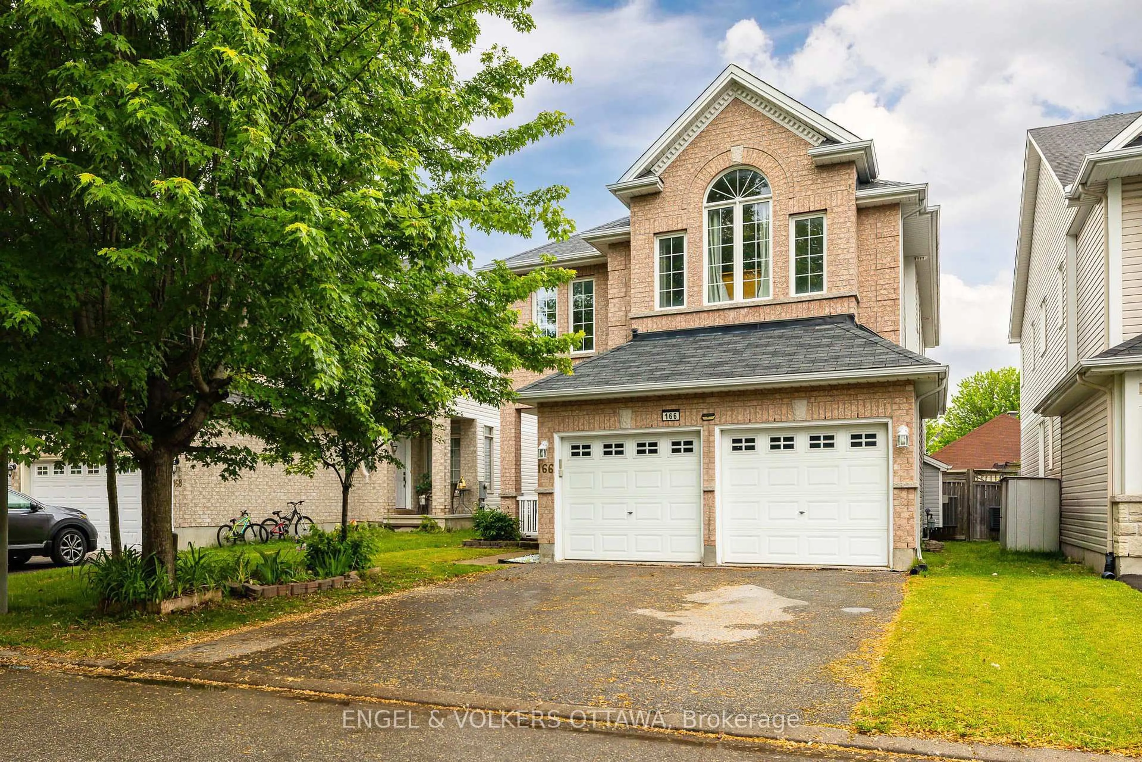 Home with brick exterior material, street for 166 Macara Cres, Kanata Ontario K2K 0C9