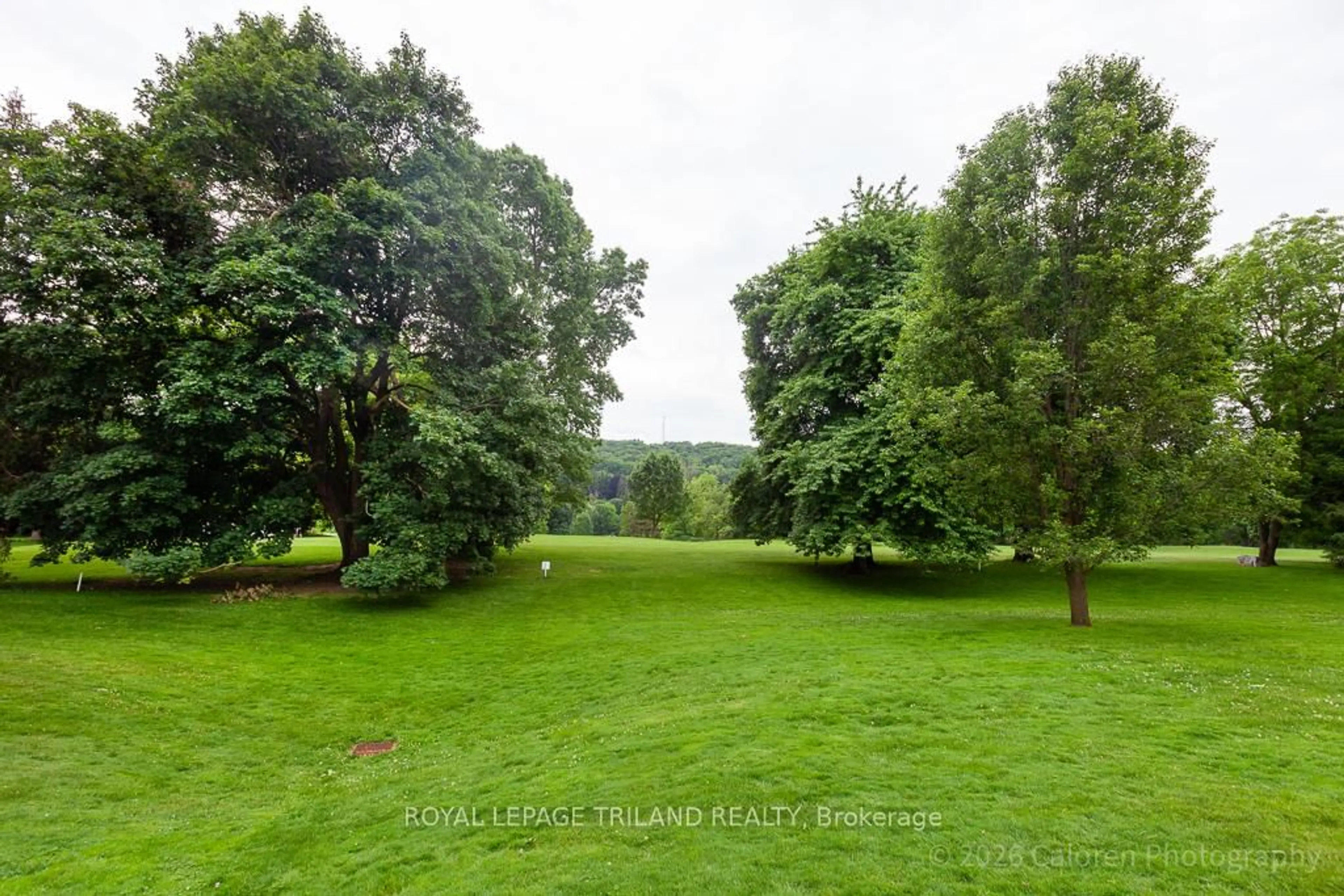 A pic from outside/outdoor area/front of a property/back of a property/a pic from drone, forest/trees view for 1040 Riverside Dr #24, London North Ontario N6H 5N4