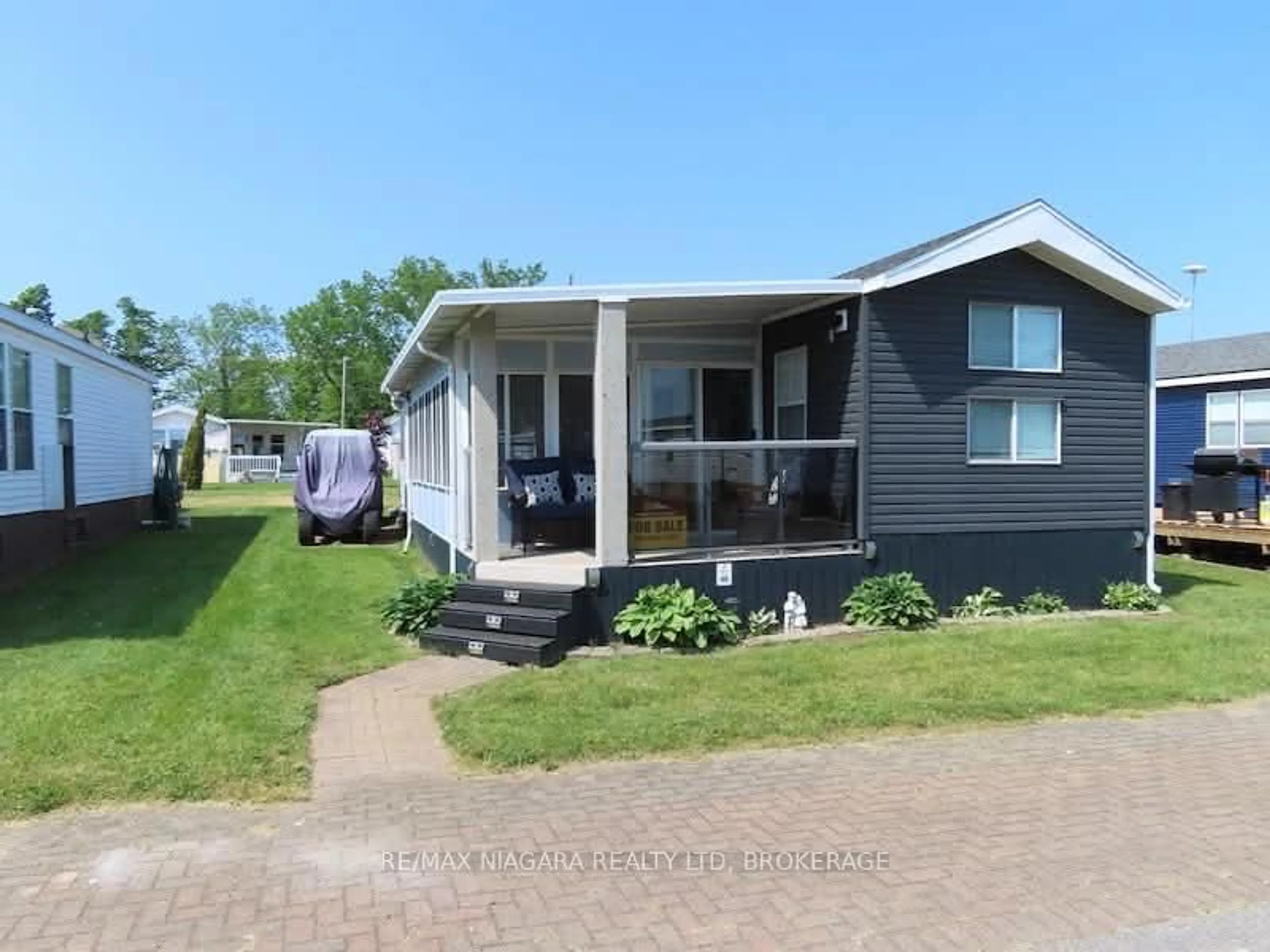 Home with vinyl exterior material, street for 48 Quarry View Village, Port Colborne Ontario L0S 1R0