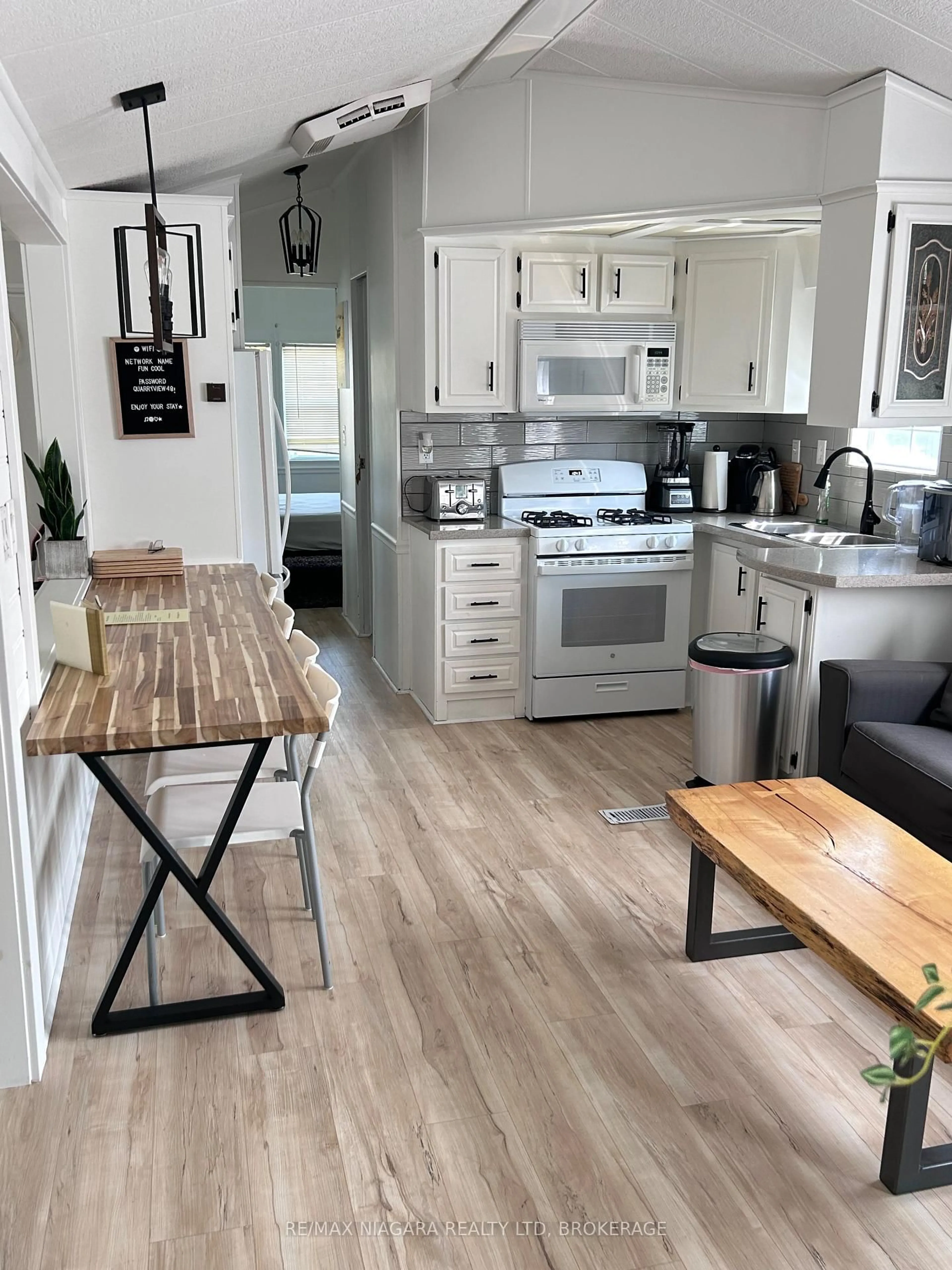 Open concept kitchen, wood/laminate floor for 48 Quarry View Village, Port Colborne Ontario L0S 1R0