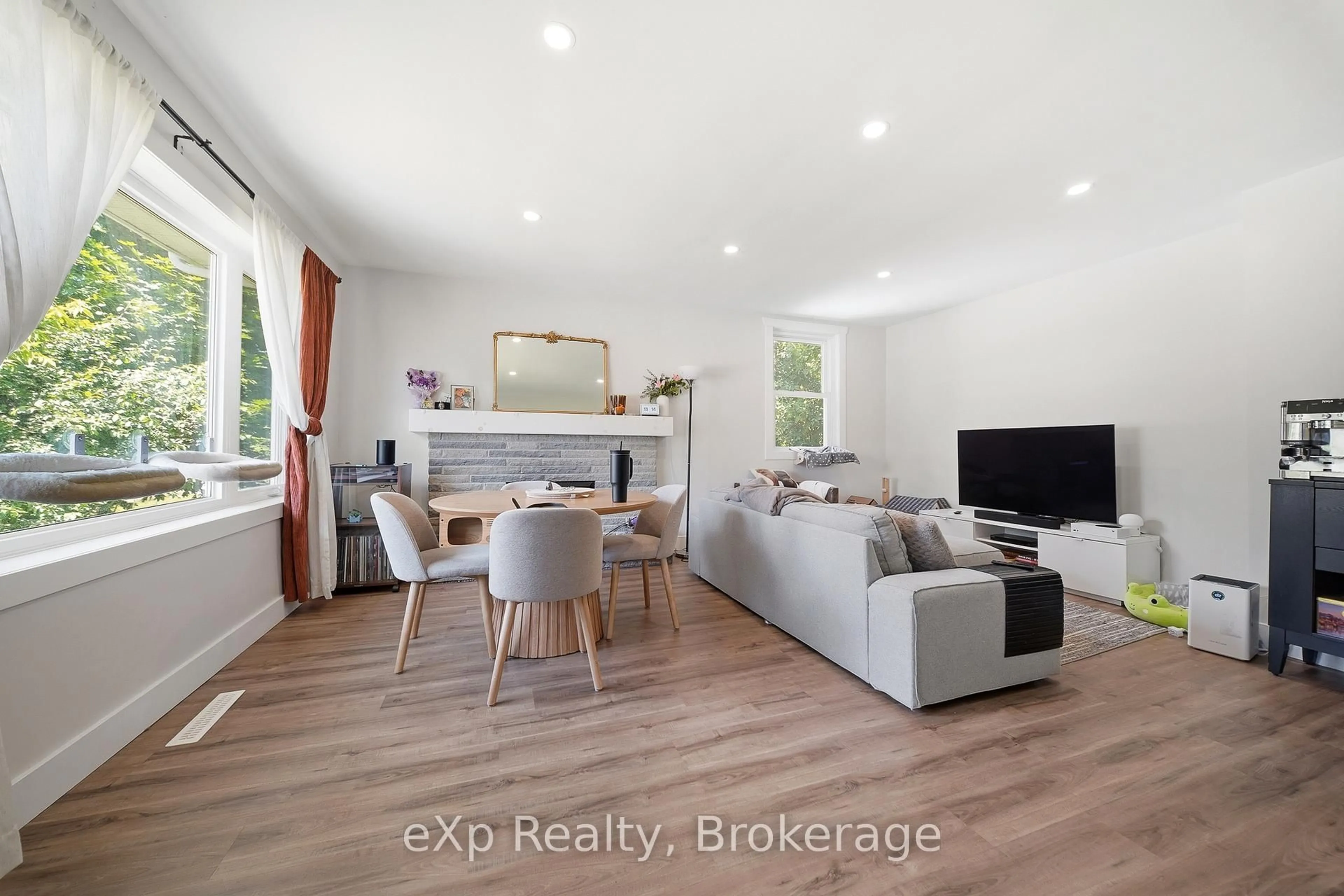 Living room with furniture, wood/laminate floor for 87 Golfdale Rd, Belleville Ontario K8N 4A8