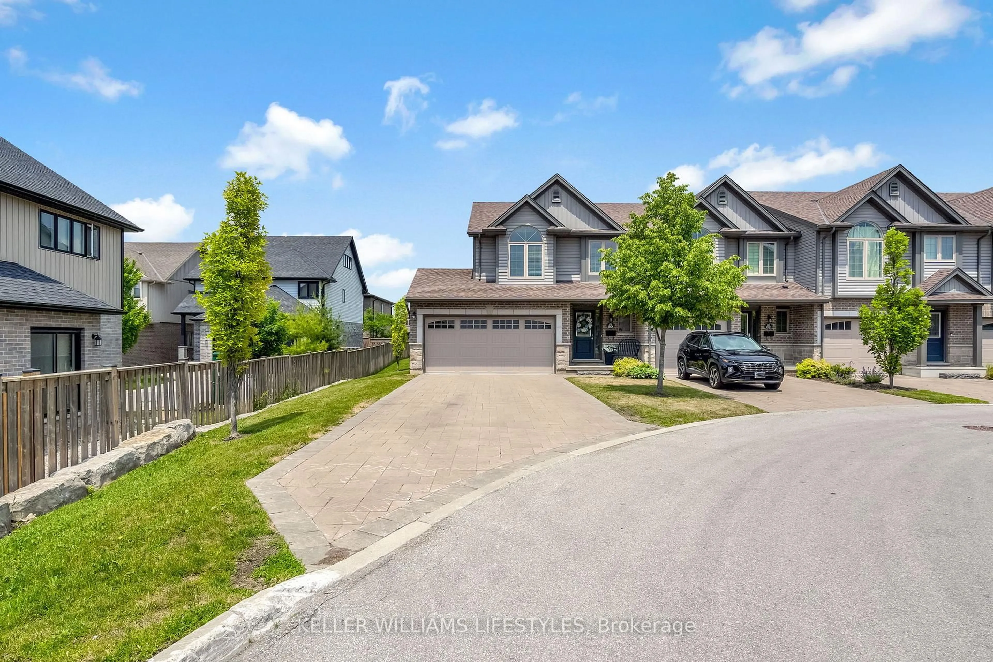A pic from outside/outdoor area/front of a property/back of a property/a pic from drone, street for 3400 Castle Rock Pl #80, London South Ontario N6L 0E4